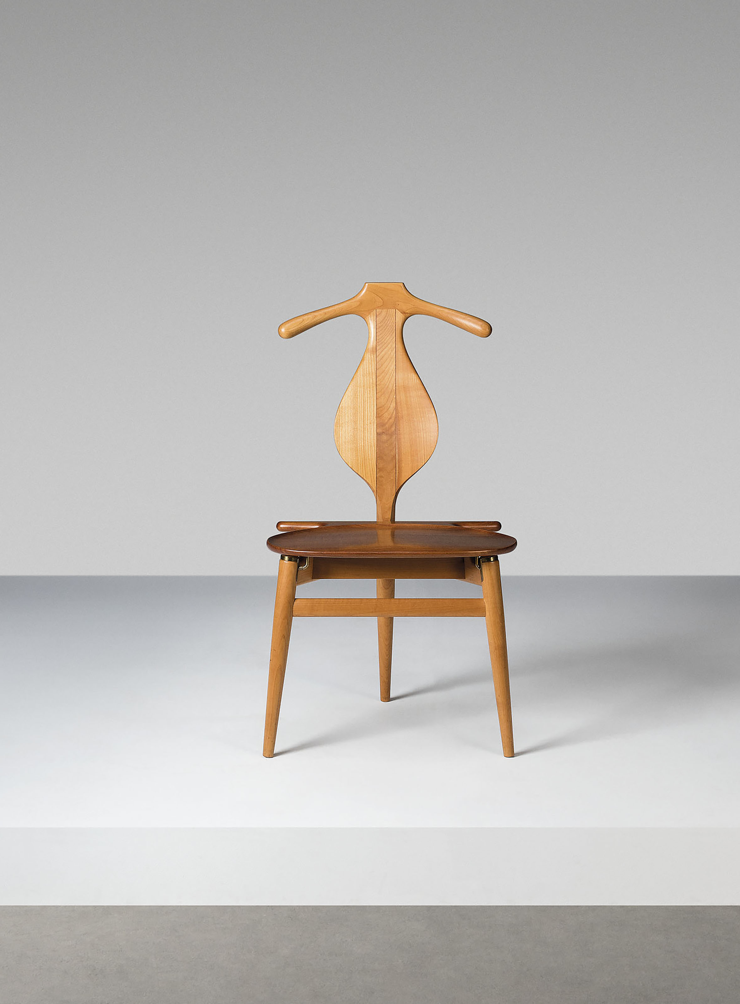 Hans Wegner, a rare cherry Valet chair, model no. JH540, designed 1953, sold for £21,250 on 16 October 2019 at Christie's in London