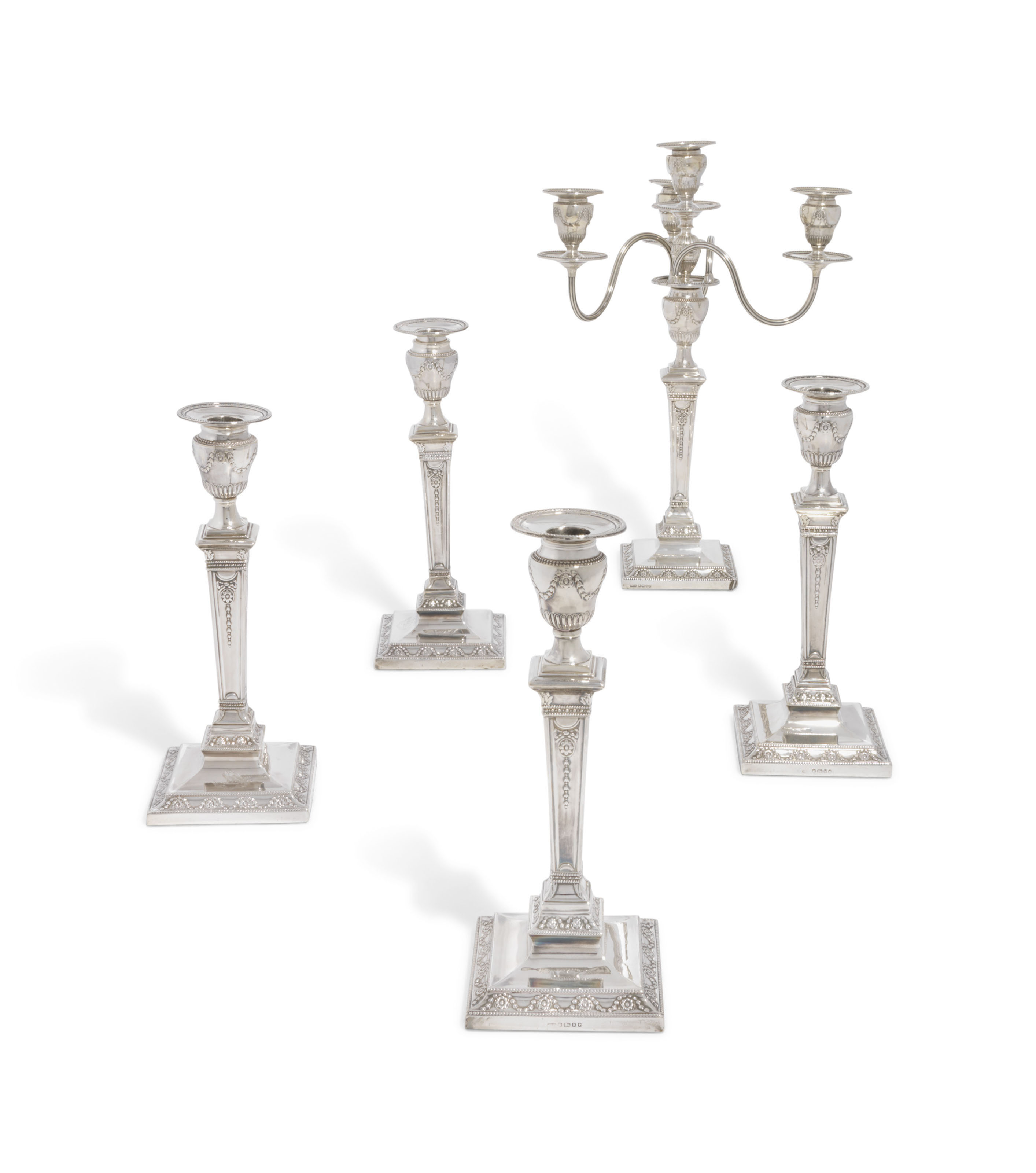 FOUR VICTORIAN SILVER CANDLESTICKS AND A FOURLIGHT CANDELABRUM