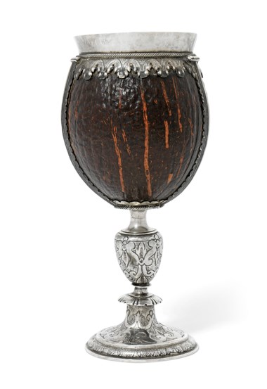 A James I silver-mounted coconut cup, circa 1600-1620. 8¾  in (22  cm) high. Estimate £15,000-25,000. Offered in The David Little Collection of Early English Silver on 3 December 2019 at Christie’s in London