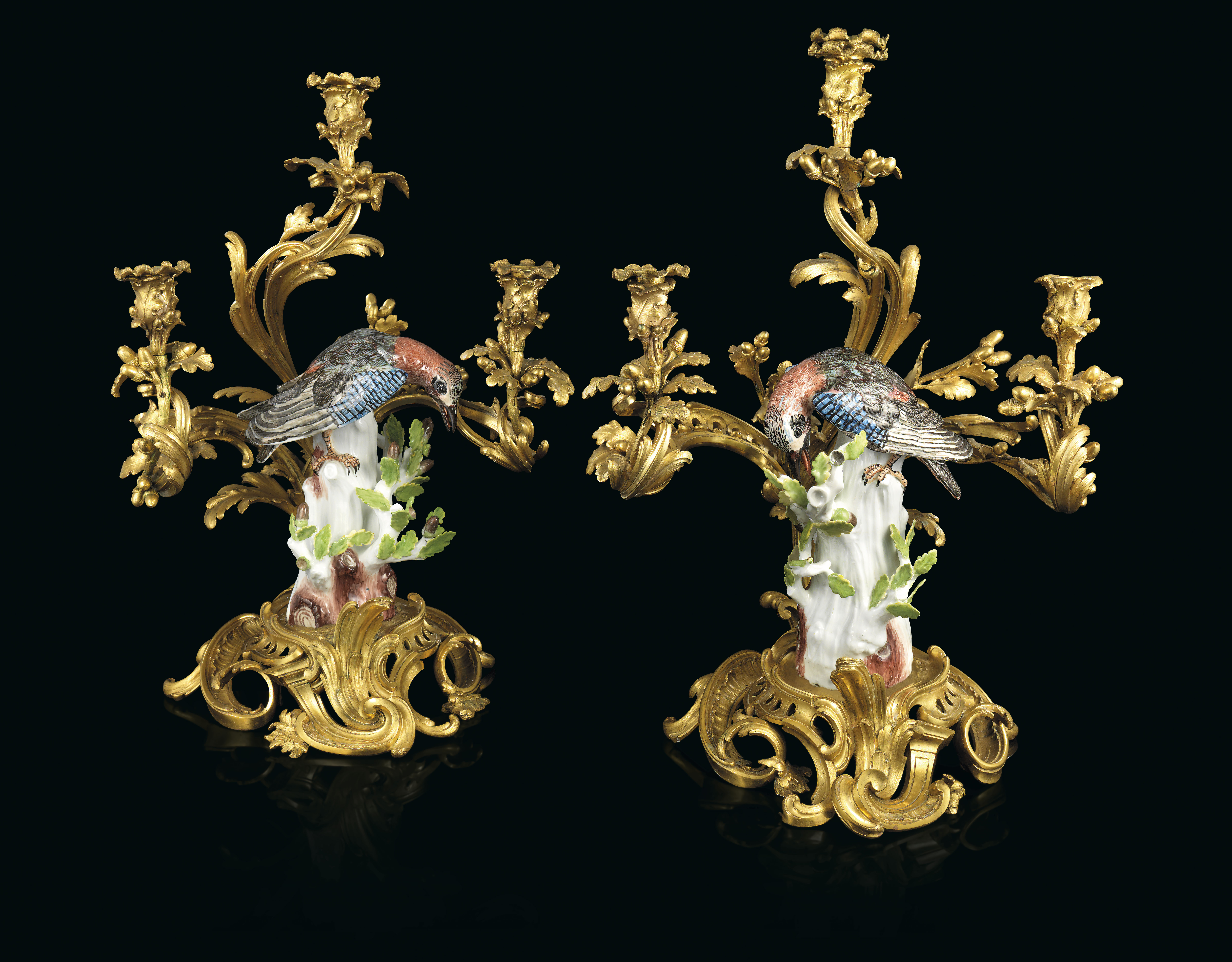 A PAIR OF LOUIS XV ORMOLU-MOUNTED MEISSEN PORCELAIN THREE-LIGHT