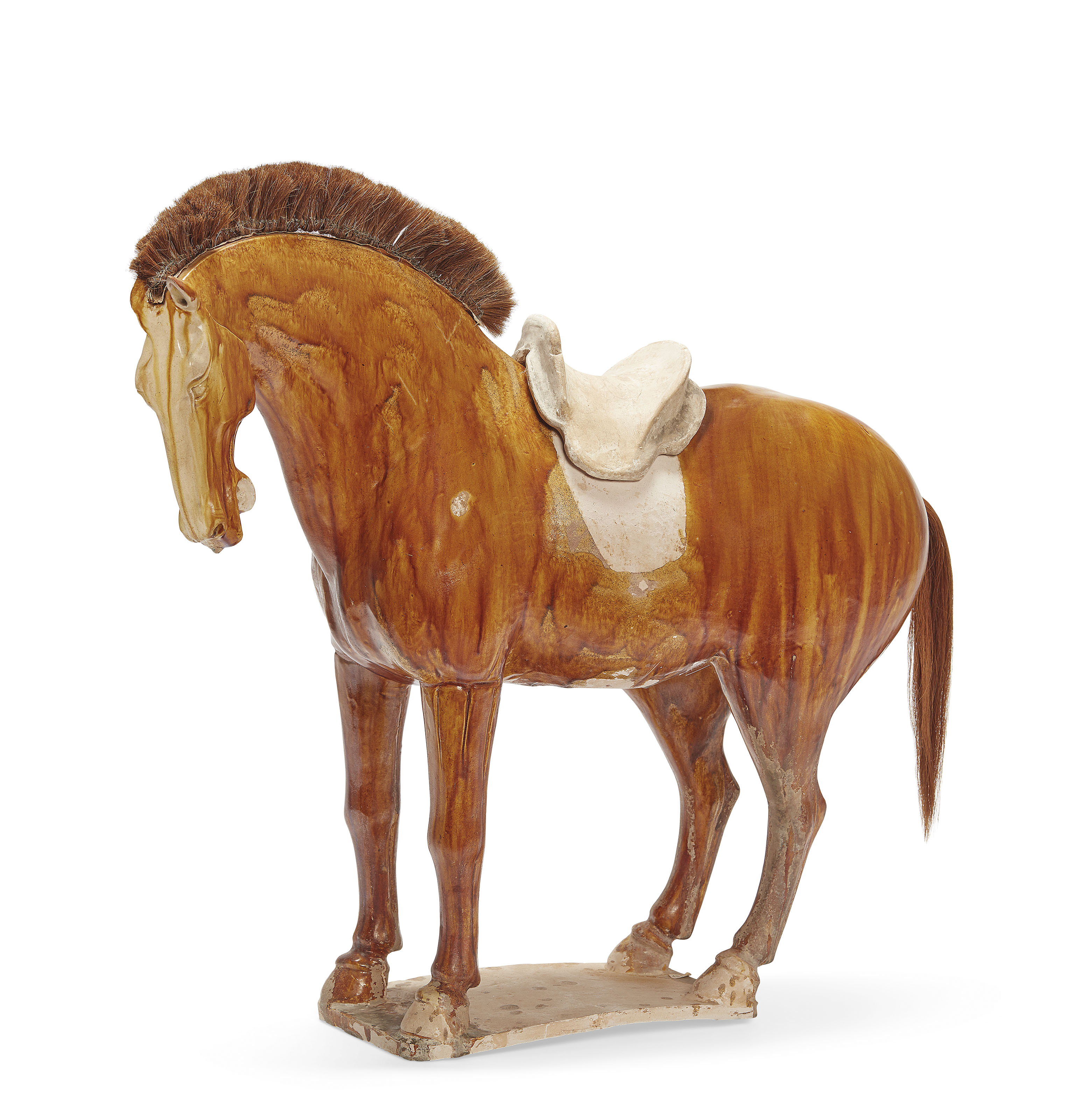 A CHINESE SANCAIGLAZED POTTERY FIGURE OF A HORSE , TANG DYNASTY (618