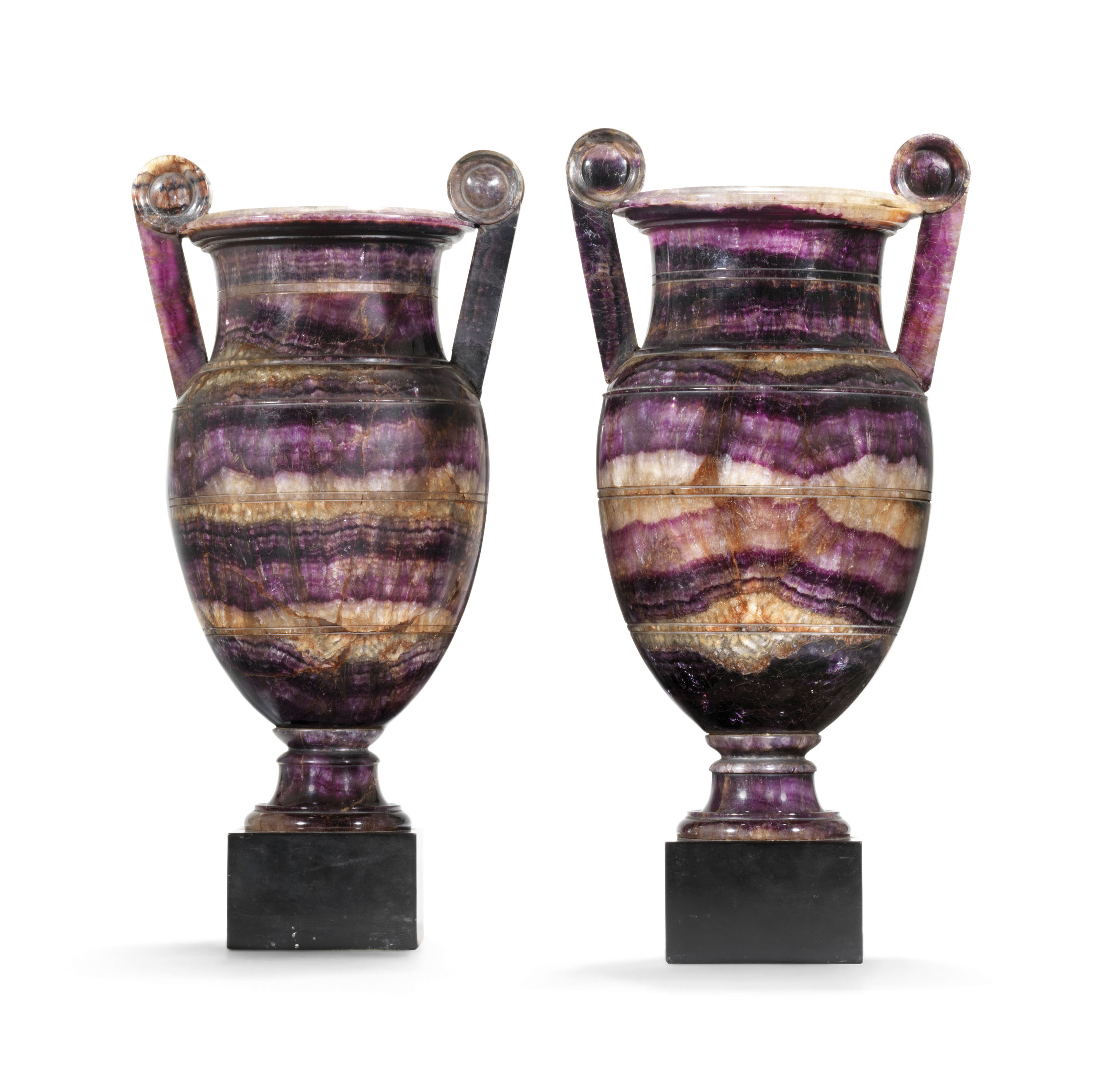 A pair of regency Blue John vases, Derbyshire, circa 1815-20, possibly by William Shore. 15&frac14;  in (38.7  cm) high, overall; 7 in (19  cm) wide; 6  in (15.2  cm) deep. Estimate: &pound;60,000-100,000. Offered in The Collection of Drue Heinz Townhouses in London and New York with interiors by John Fowler and Renzo Mongiardino on 4 June 2019 at Christie&rsquo;s in London