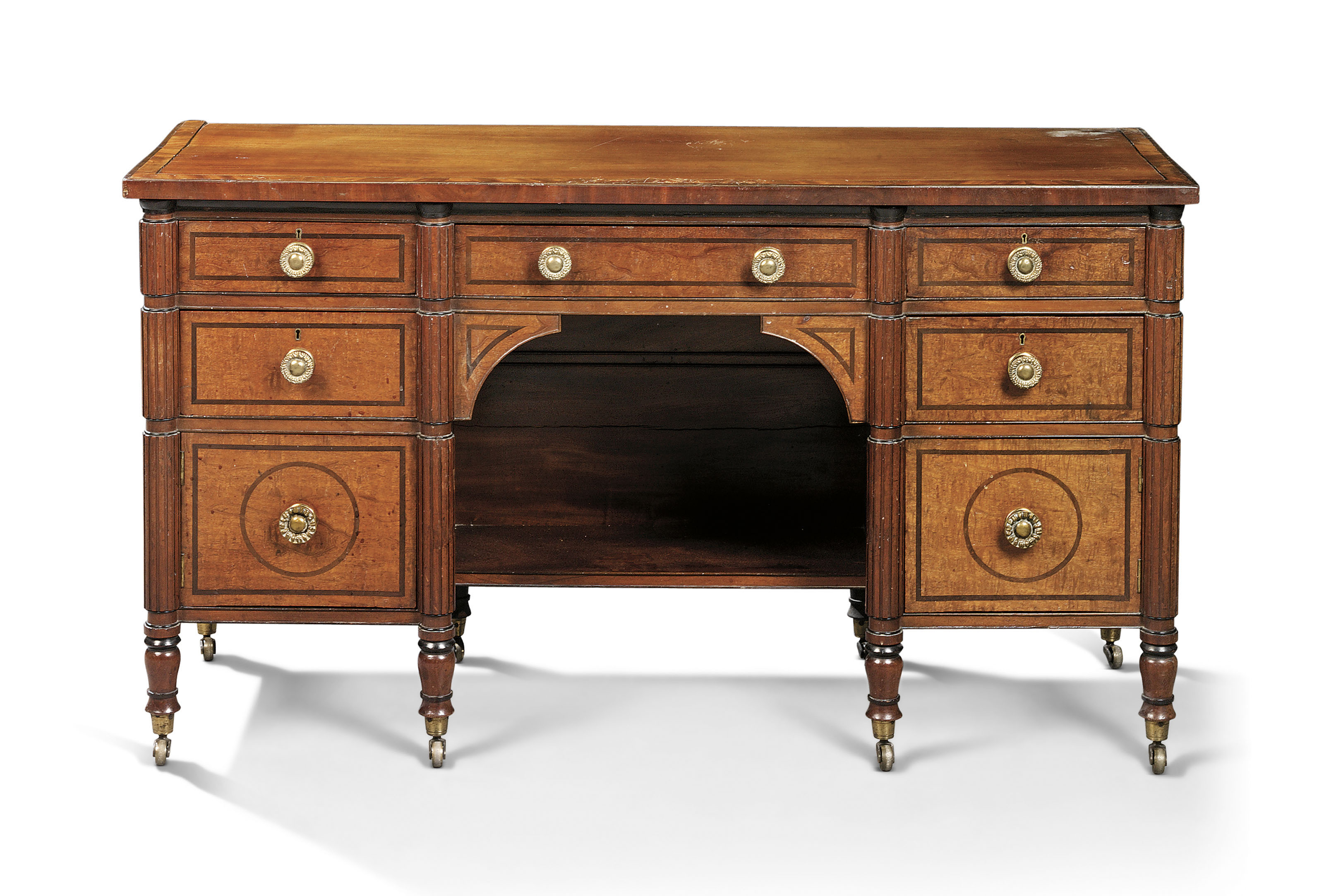 A Regency Ebony Inlaid Mahogany Kneehole Dressing Table