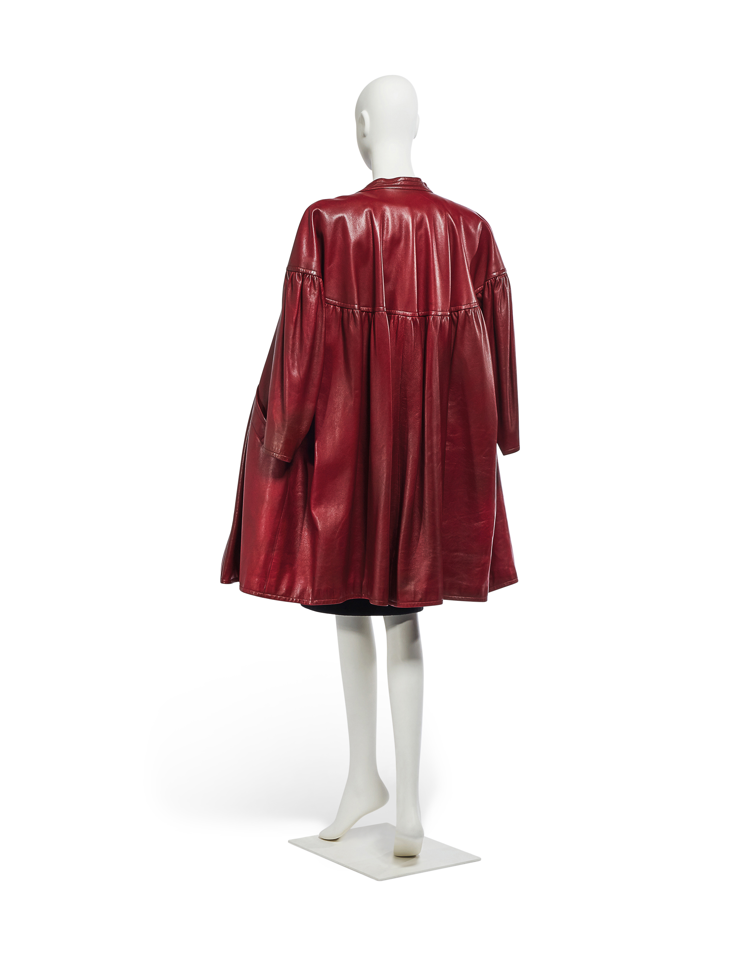 YVES SAINT LAURENT HAUTE COUTURE SPRING SUMMER 1981, A BURGUNDY LEATHER  COAT WITH A BLACK WOOL DRESS | Christie's
