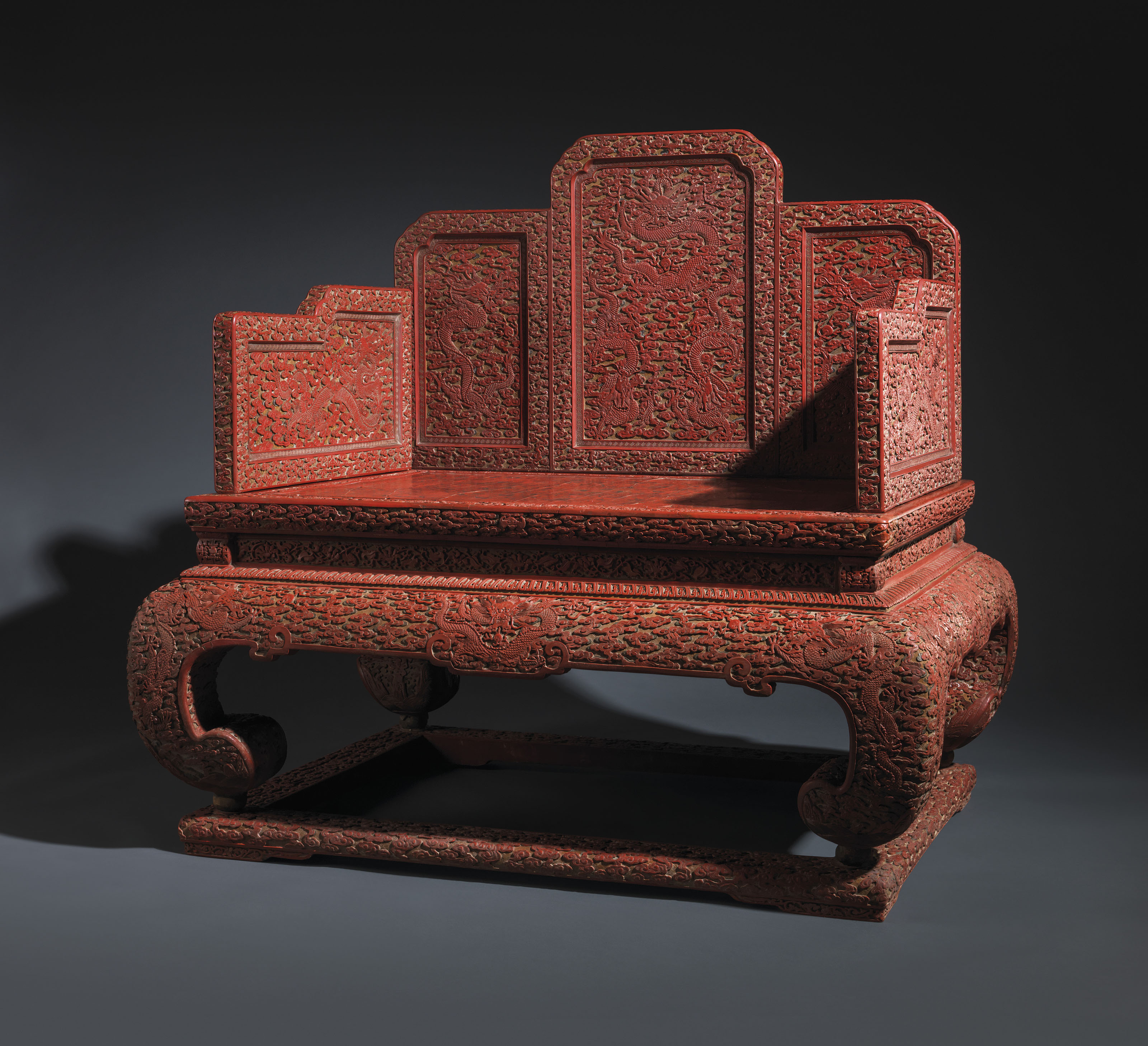 A very rare and magnificent imperial three-colour carved &lsquo;Nine Dragon&rsquo; lacquer throne, Qianlong period (1736-1795). 43&frac14;  in (111.1cm) high; 45&frac12;  in (115.5 cm) wide; 33&frac34;  in (85.7 cm) deep. Estimate: &pound;800,000-1,200,000. Offered in Dragon Throne for the Son of Heaven on 14 May 2019 at Christie&rsquo;s in London