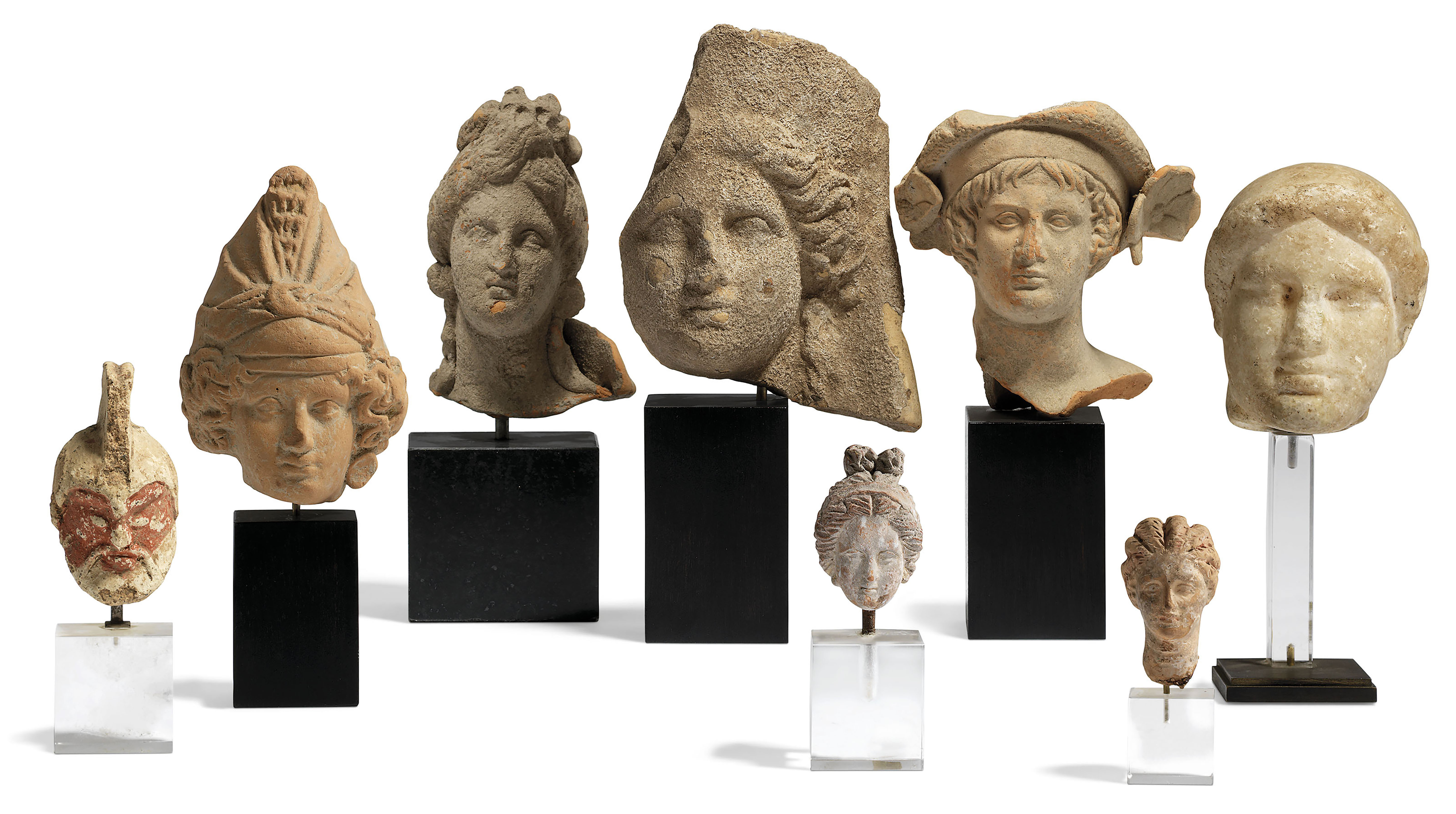 EIGHT GREEK TERRACOTTA AND MARBLE HEADS , CLASSICAL PERIOD-HELLENISTIC