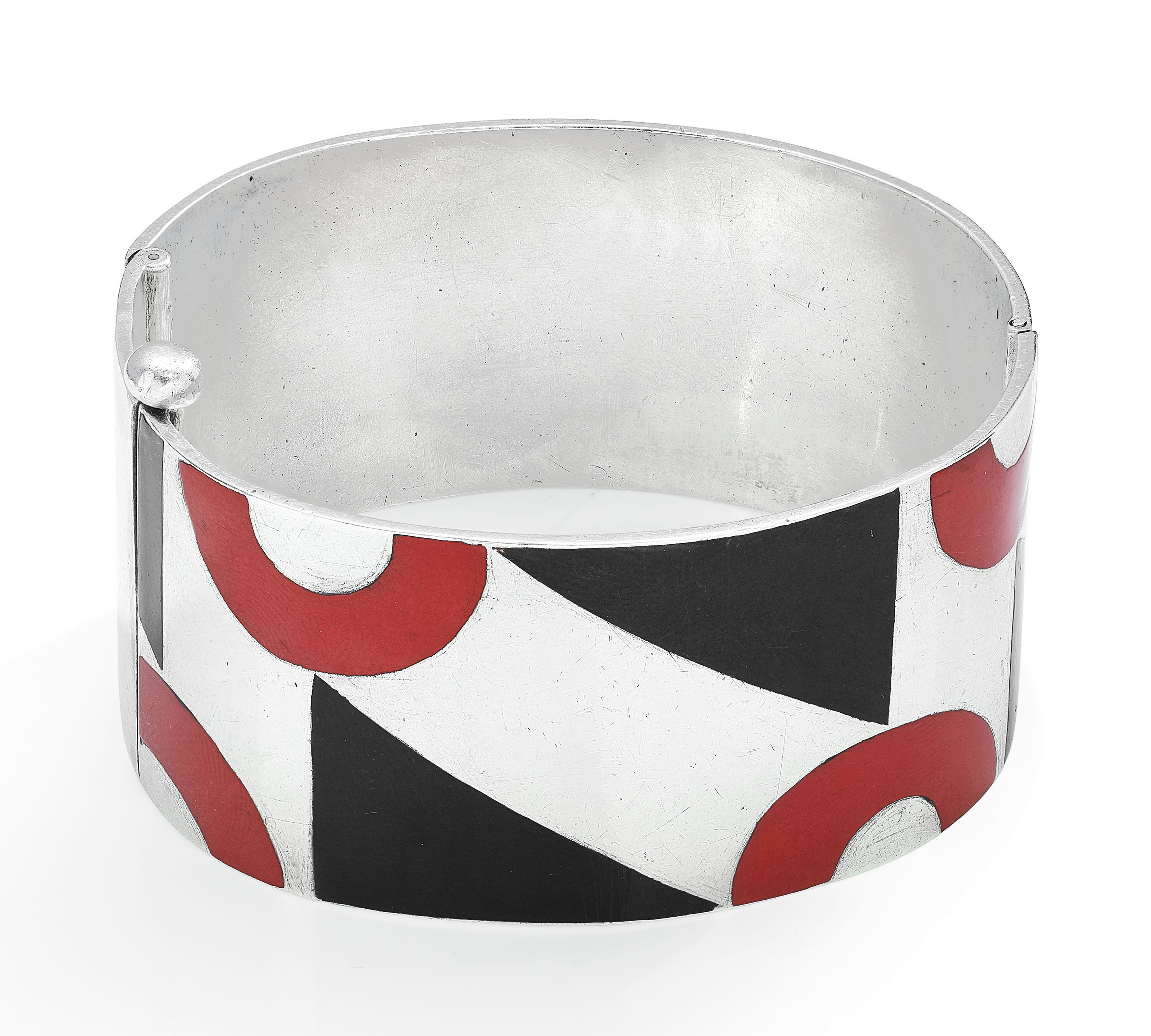 Paul Brandt, Art Deco lacquer cuff bracelet, circa 1928. Red and black lacquer, silver (French marks), inner circumference 15.8 cm, signed Paul Brandt. Sold for CHF 27,500 on 15 May 2019 at Christie&rsquo;s in Geneva