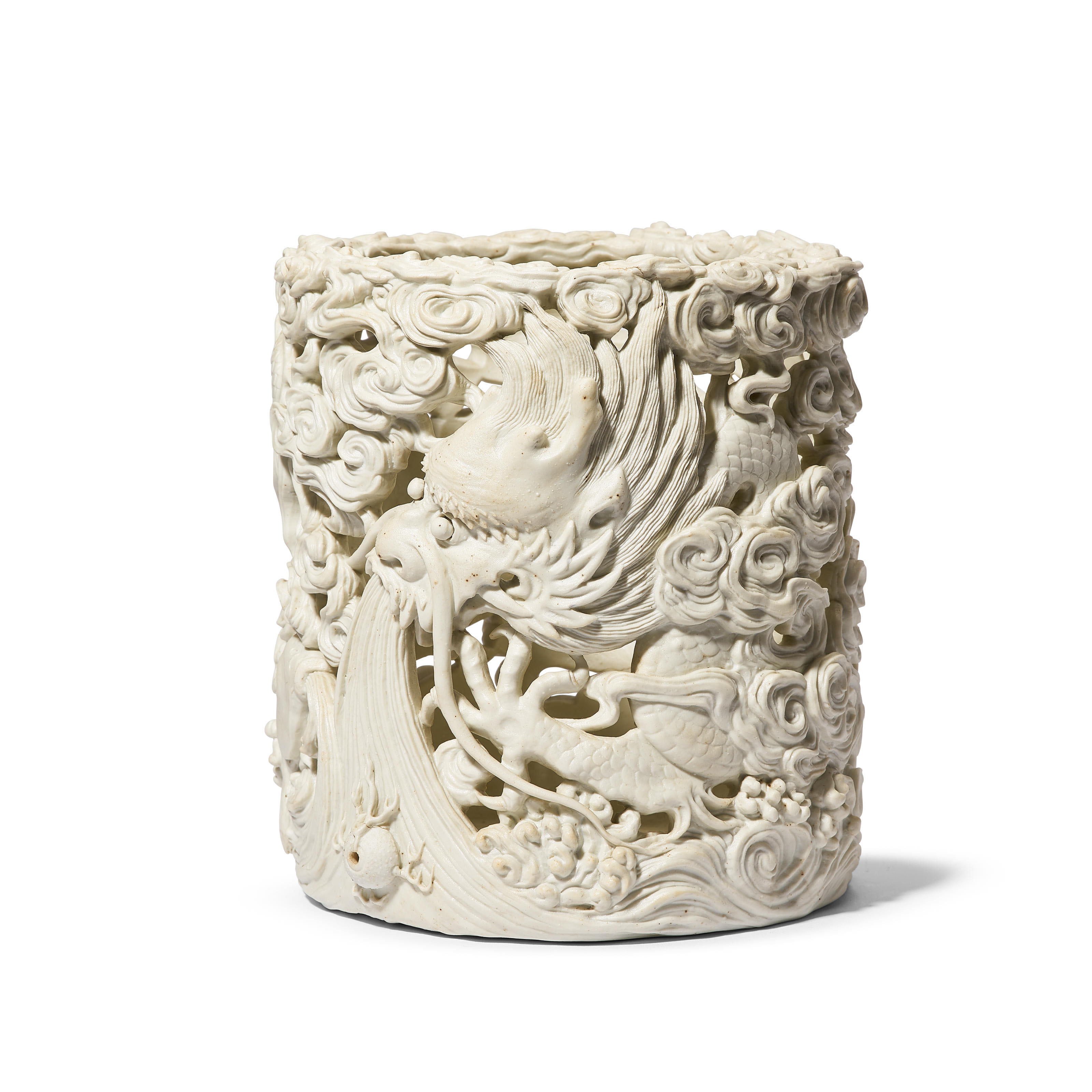A CARVED BISCUIT PORCELAIN 'DRAGON' BRUSHPOT, REPUBLIC PERIOD