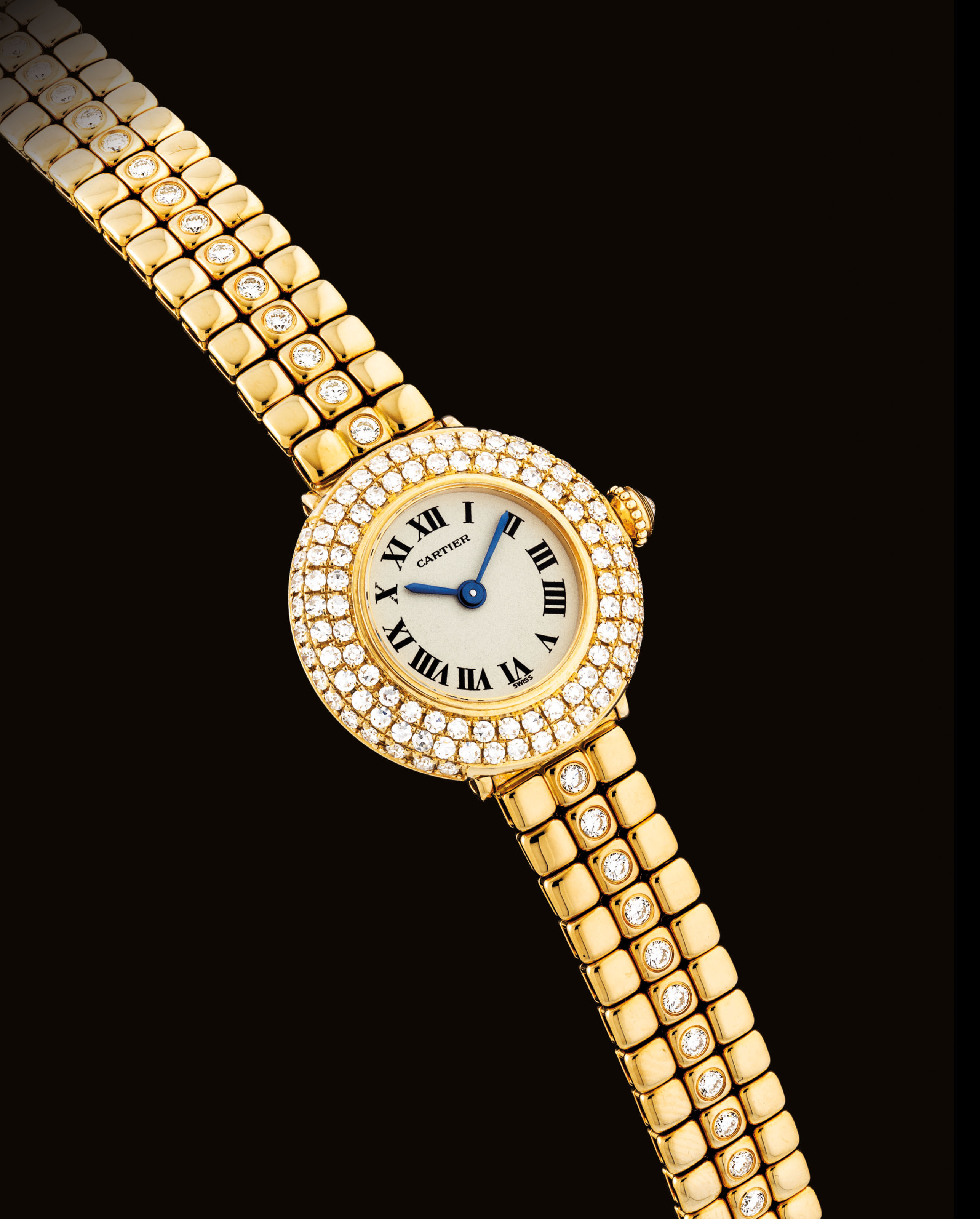 CARTIER. A LADY'S FINE 18K GOLD AND DIAMONDSET BRACELET WATCH