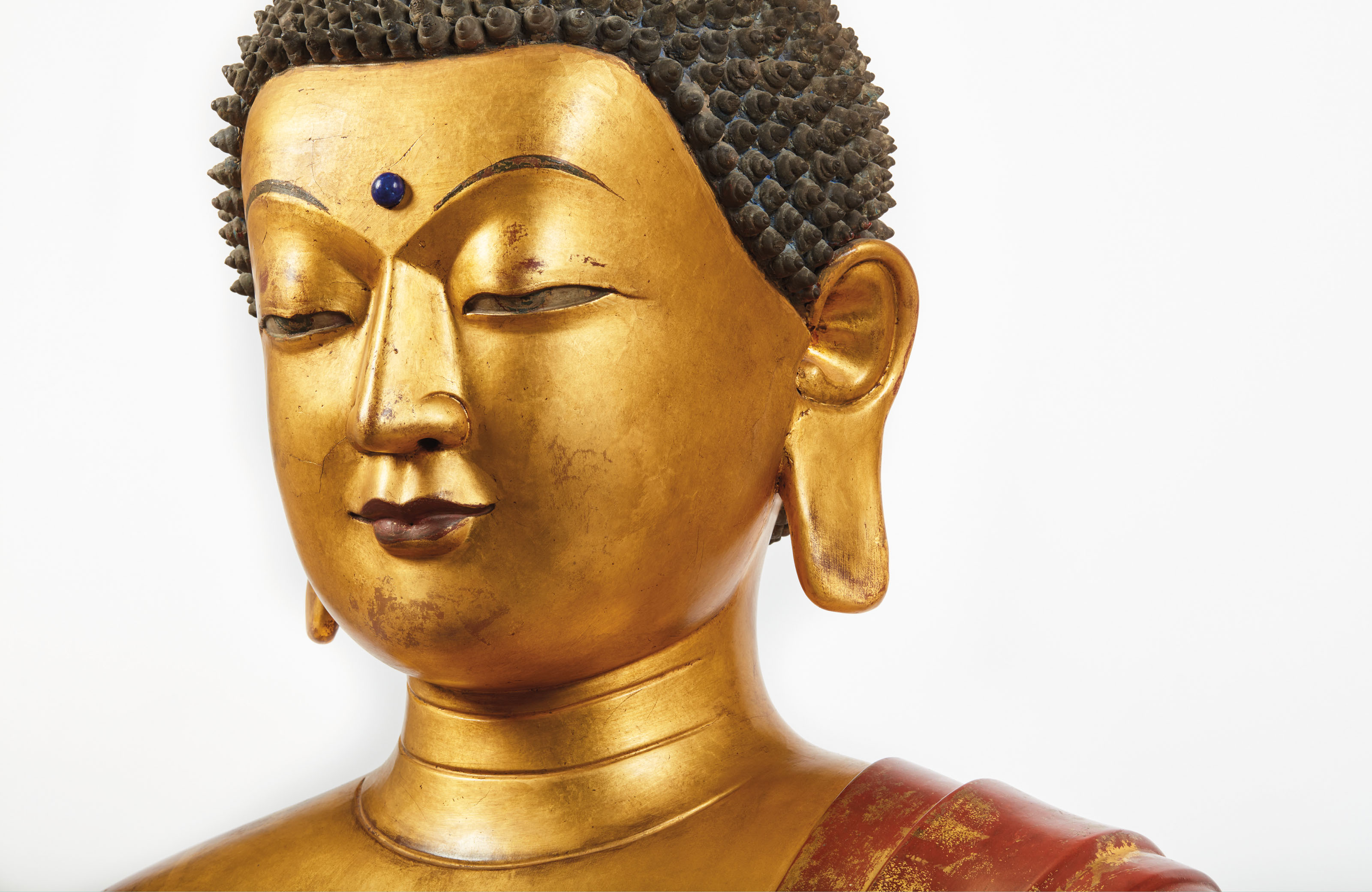 a highly important and monumental imperial gilt lacquered wood figure of the medicine buddha