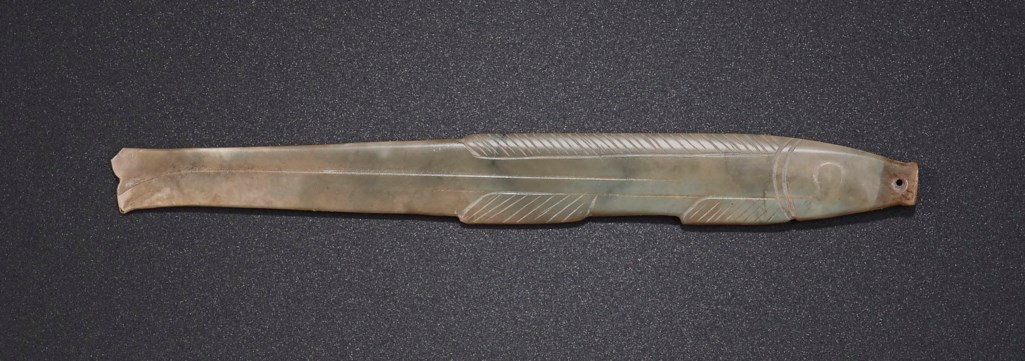 A GREYISH-GREEN JADE FISH-FORM PENDANT