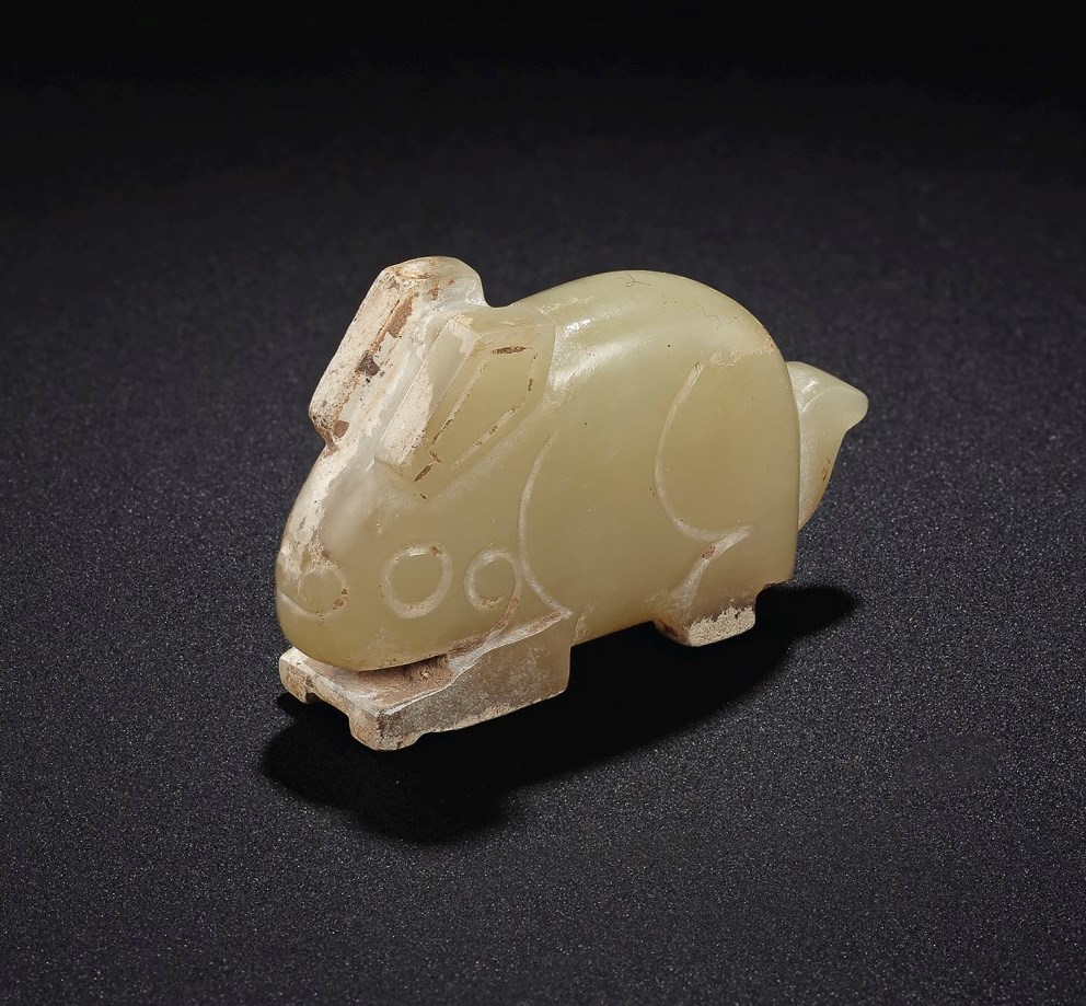 A PALE GREENISH-YELLOW JADE RABBIT-FORM PENDANT