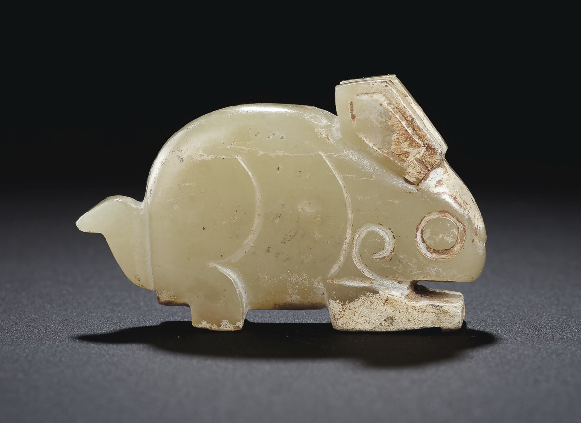 A PALE GREENISHYELLOW JADE RABBITFORM PENDANT , LATE SHANGEARLY