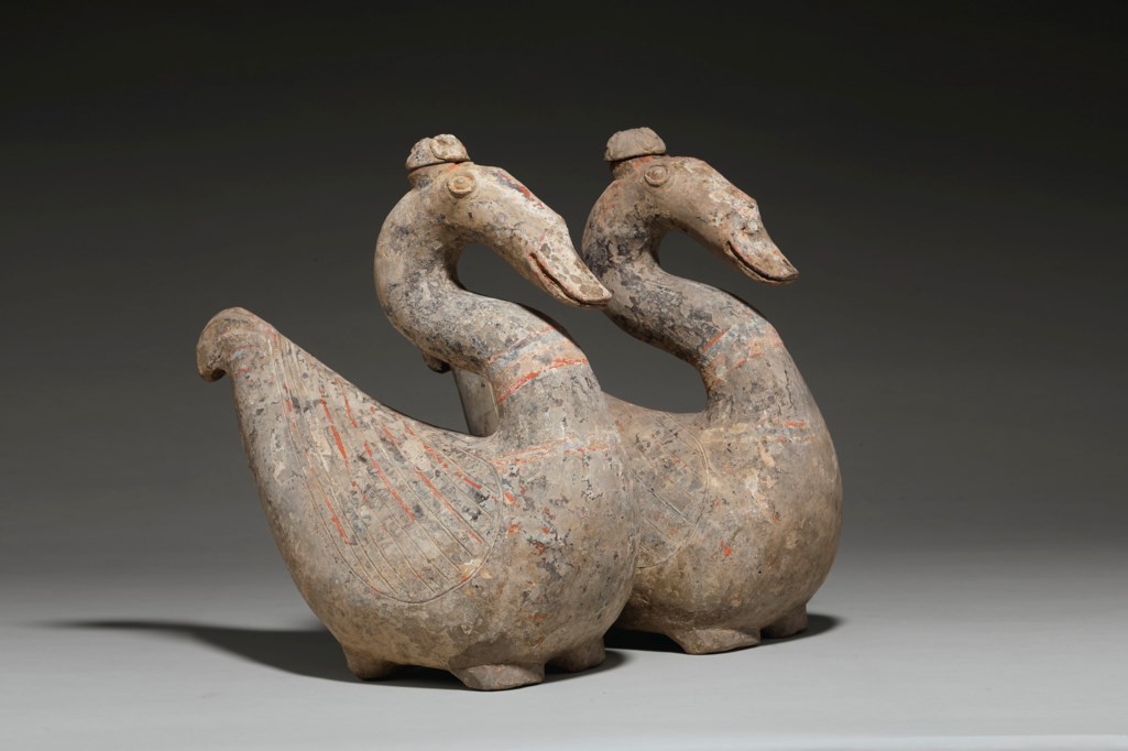 A RARE PAIR OF PAINTED POTTERY GOOSE-FORM VESSELS AND COVERS