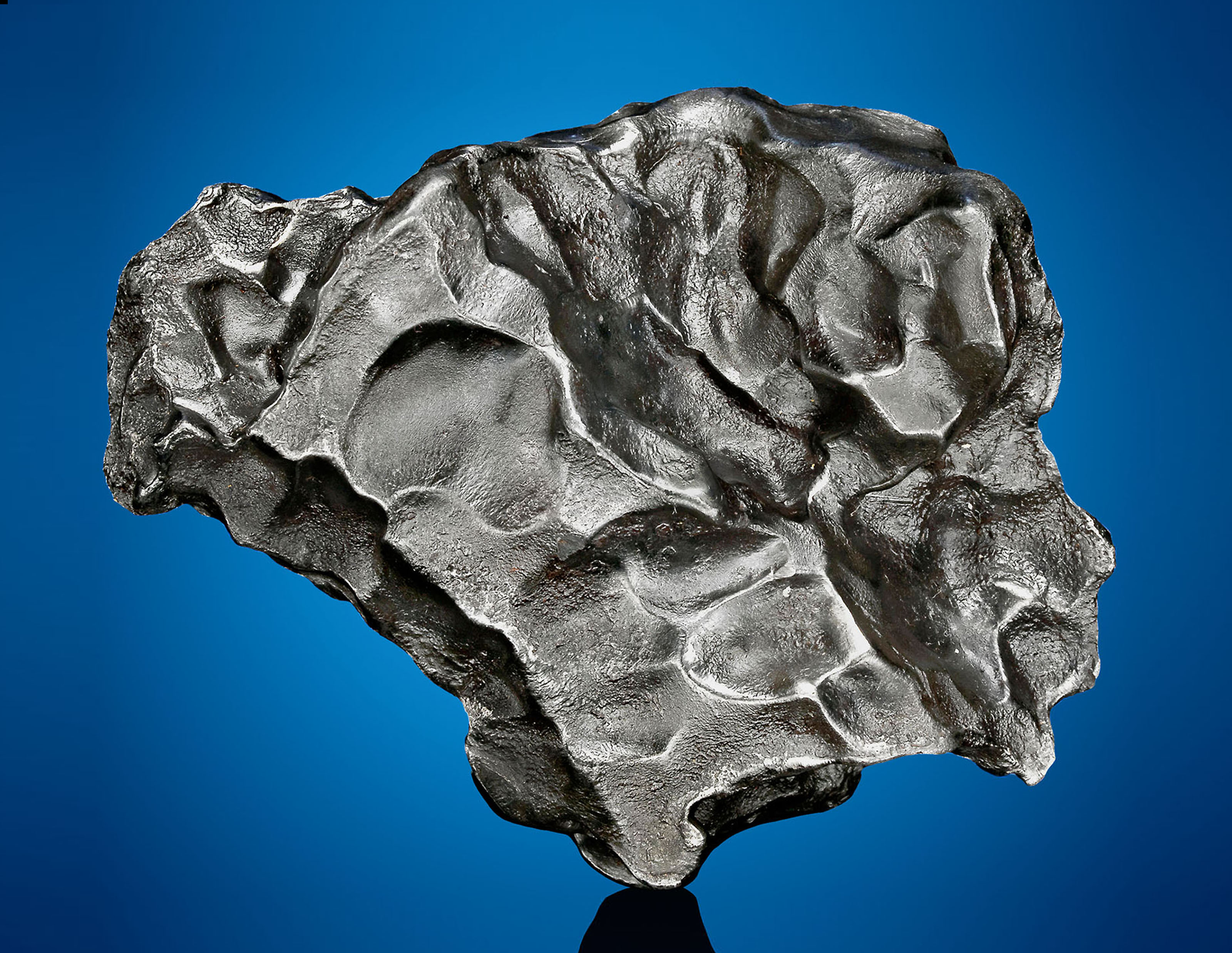 SIKHOTE ALIN METEORITE — AN ENGAGING PALMSIZED METEORITE, Iron, coarse