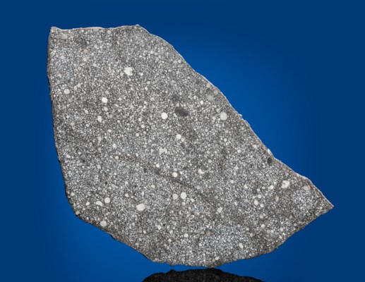 a complete slice of a primitive stone meteorite