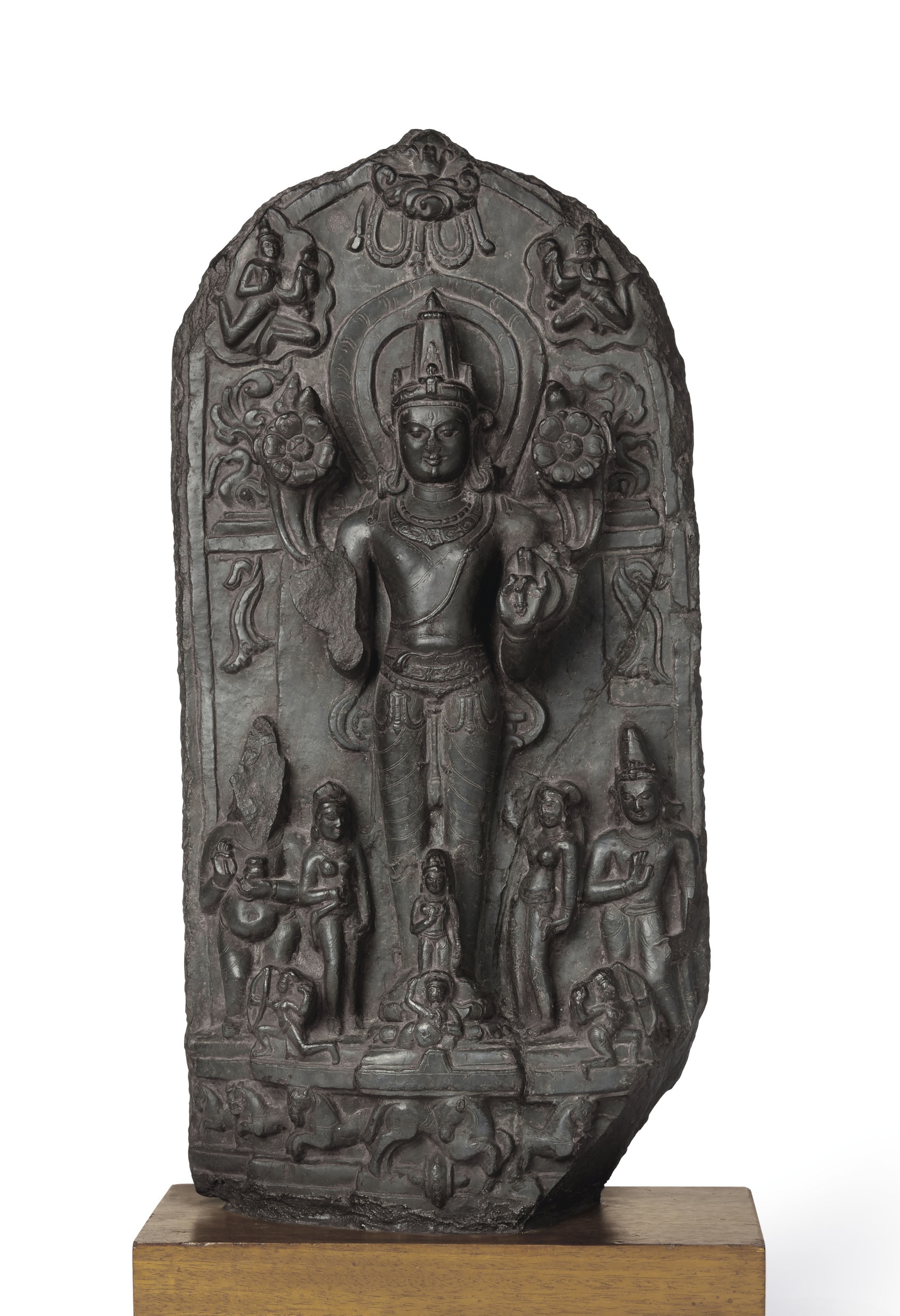 A BLACK STONE STELE OF SURYA