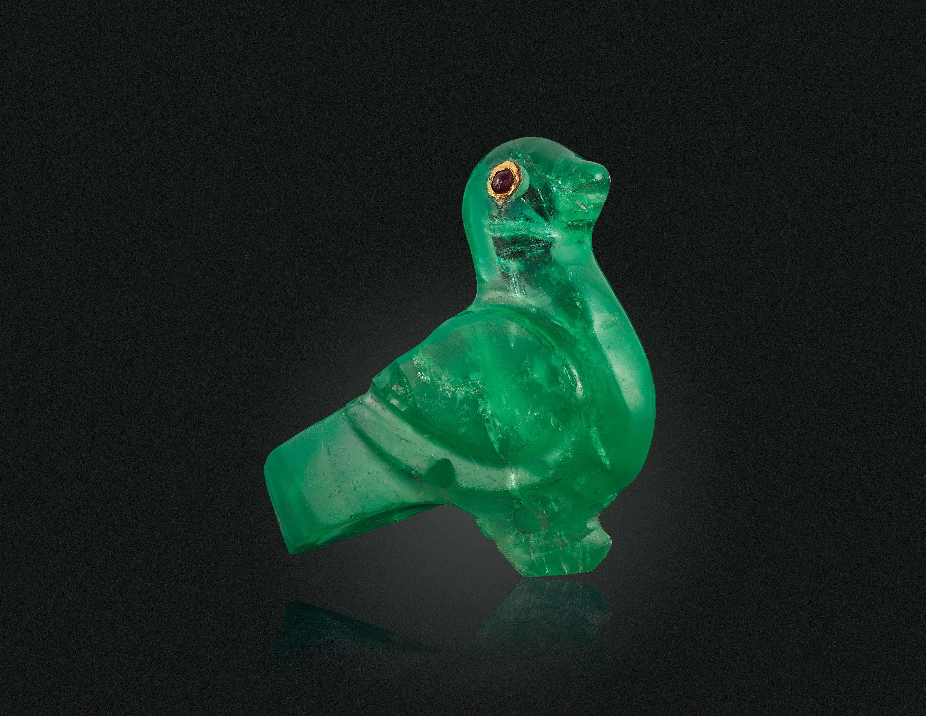 AN ANTIQUE CARVED EMERALD AND RUBY BIRD | Christie's