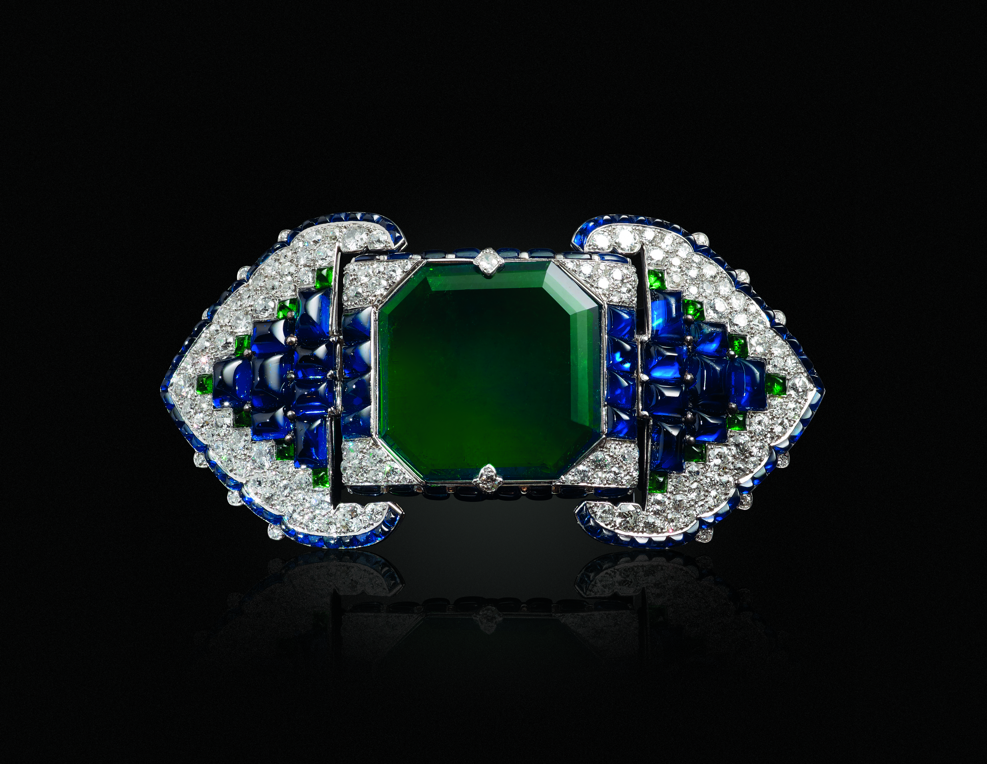 An Art Deco emerald, sapphire and diamond belt-buckle brooch, Cartier, sold for $1,545,000 on 19 June 2019 at Christie's in New York
