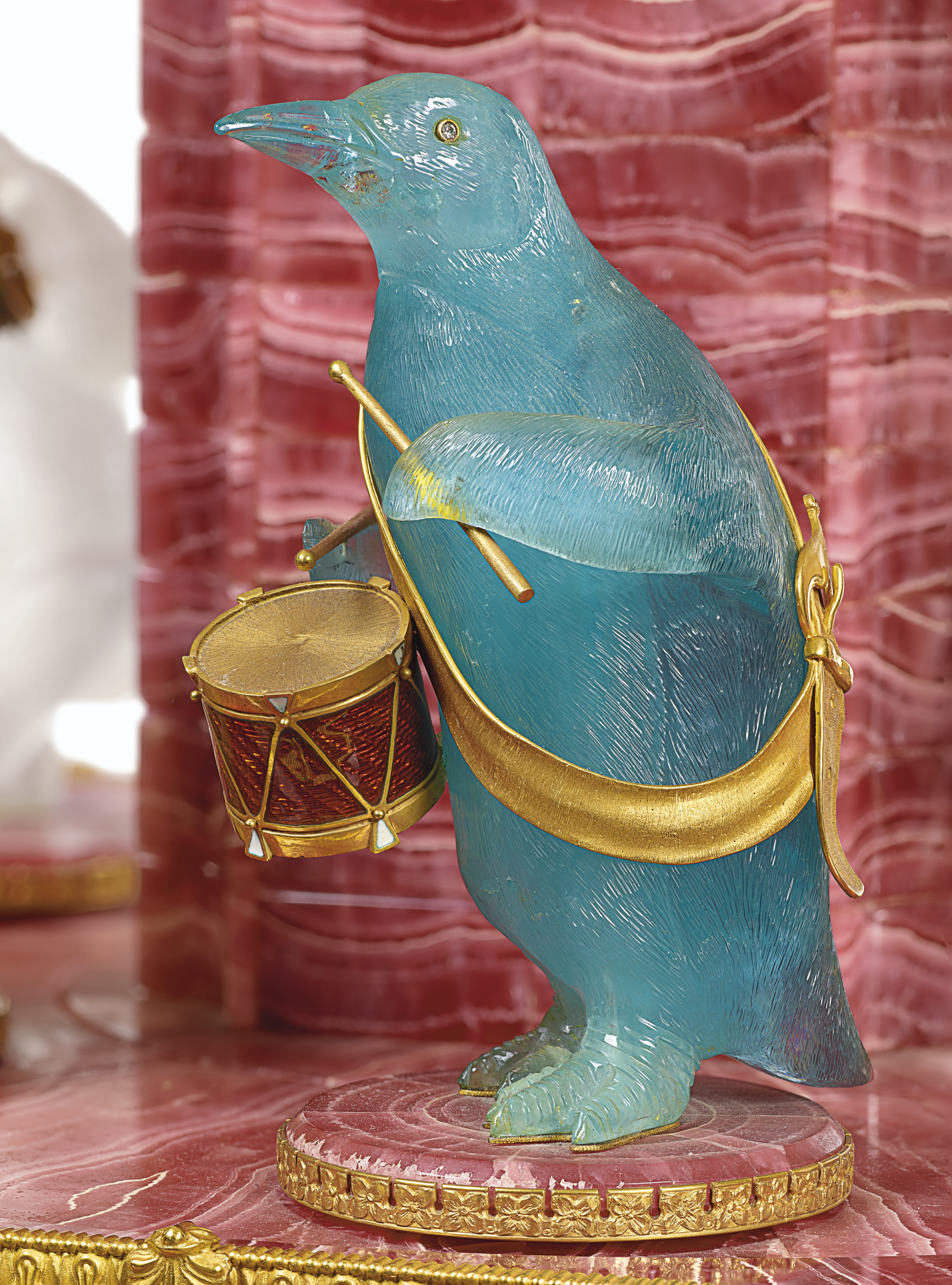 A GOLD, GEM, AND HARDSTONE-MOUNTED RHODOCHROSITE MUSICAL CLOCK ON