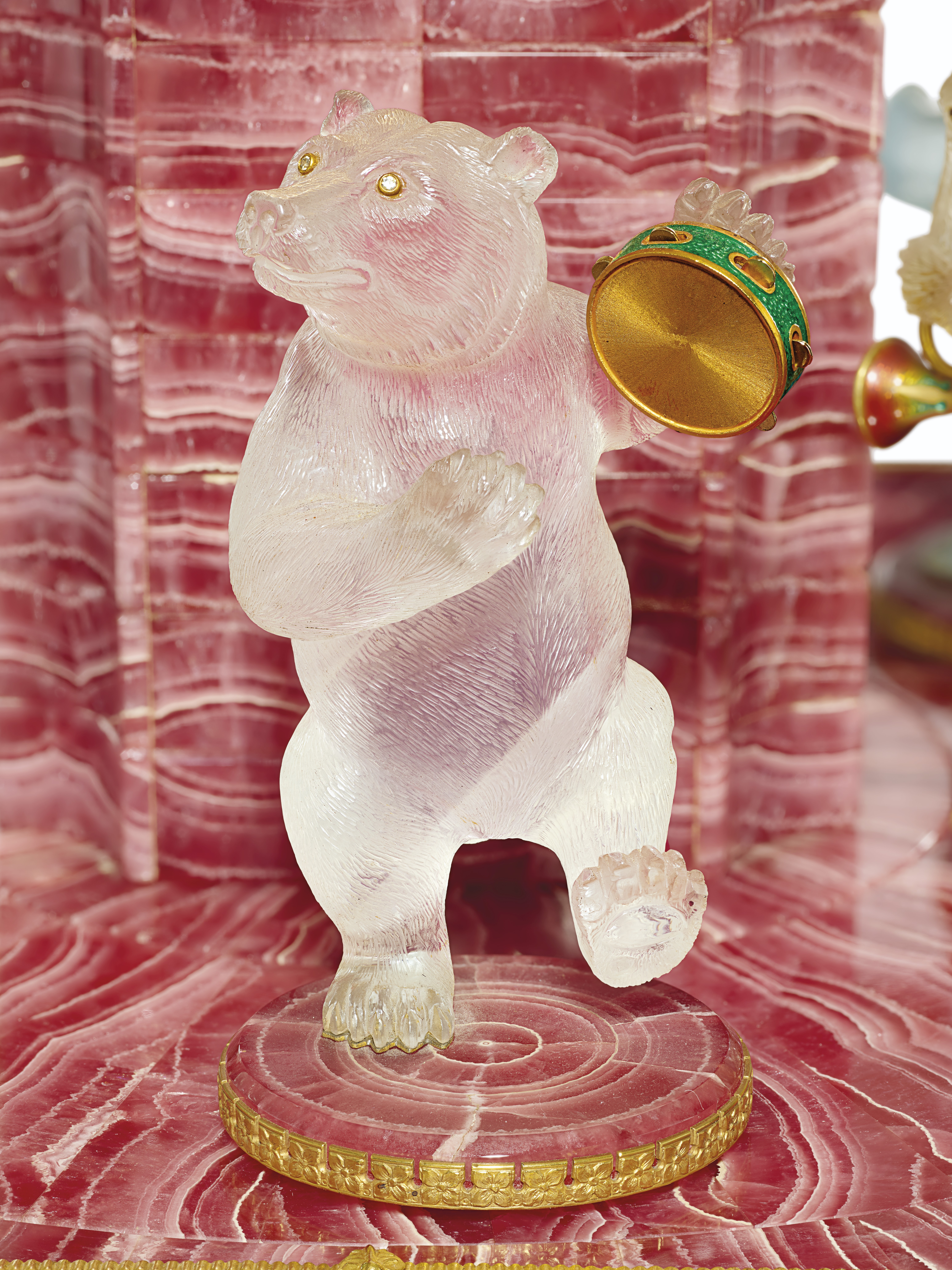 A GOLD, GEM, AND HARDSTONE-MOUNTED RHODOCHROSITE MUSICAL CLOCK ON