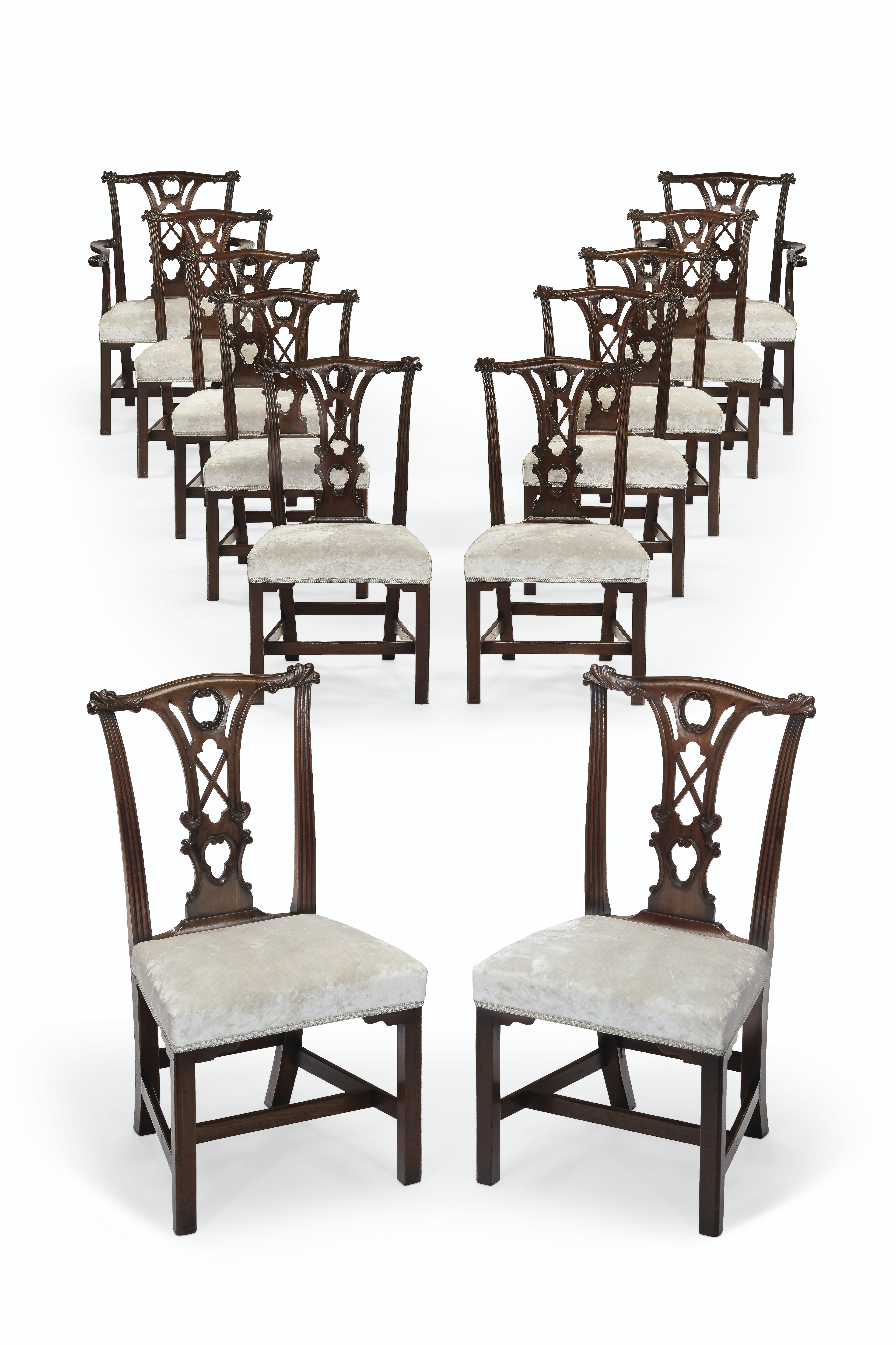 A SET OF TWELVE IRISH III MAHOGANY DINING CHAIRS , CIRCA 1760, WITH TWO ARMCHAIRS OF A