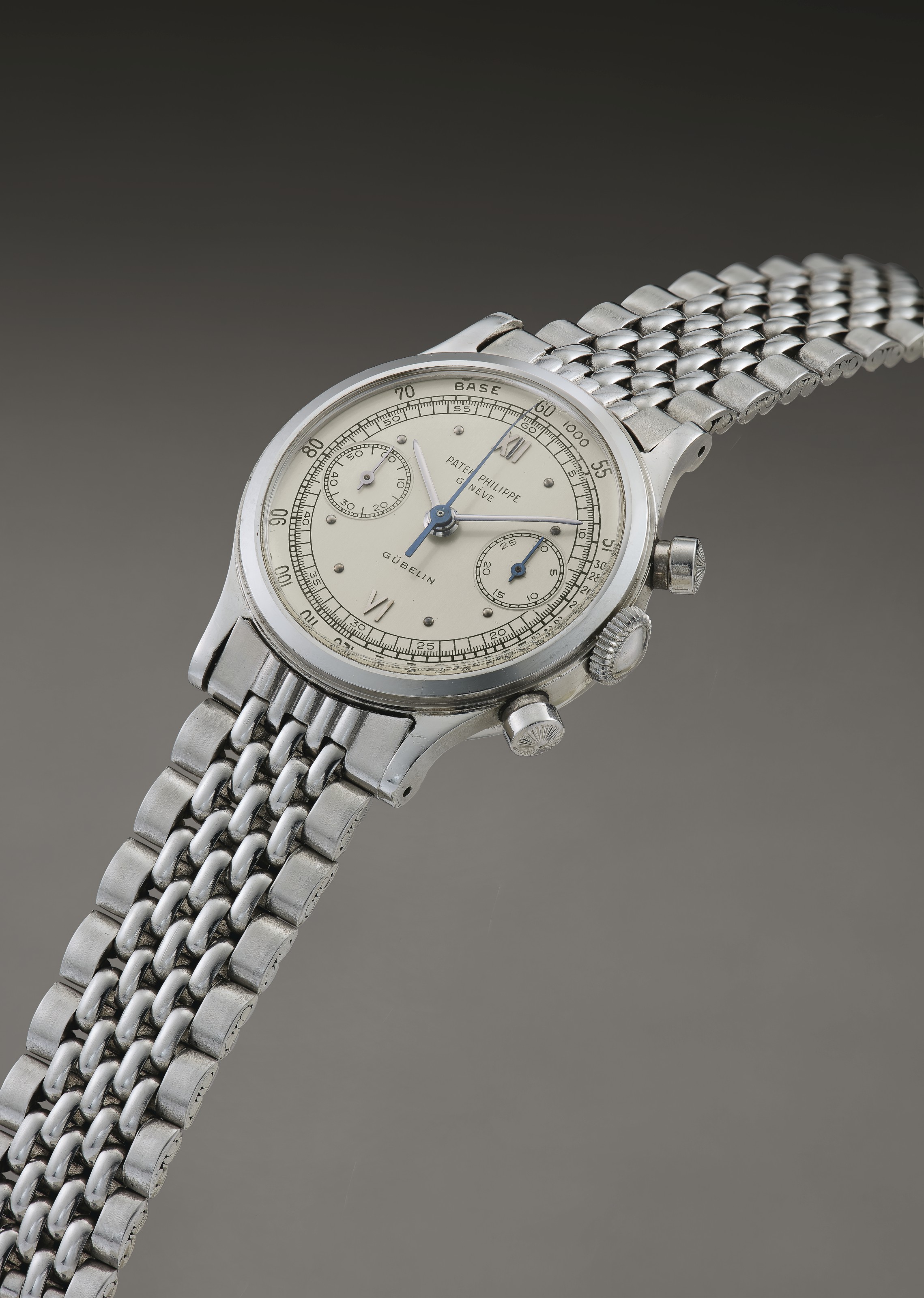 Patek Philippe. An Extremely Fine Rare and Attractive Stainless Steel Chronograph Wristwatch with Bracelet Signed Patek Philippe Geneve retailed by Gubelin Ref. 1463 Movement No. 869 002 Case No. 2 60...