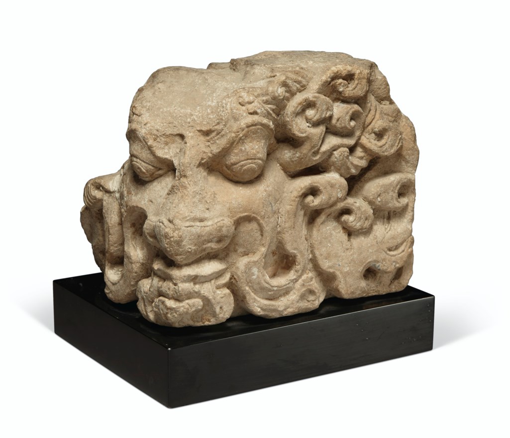 A BUFF SANDSTONE CORNER RELIEF OF A RAKSHASA