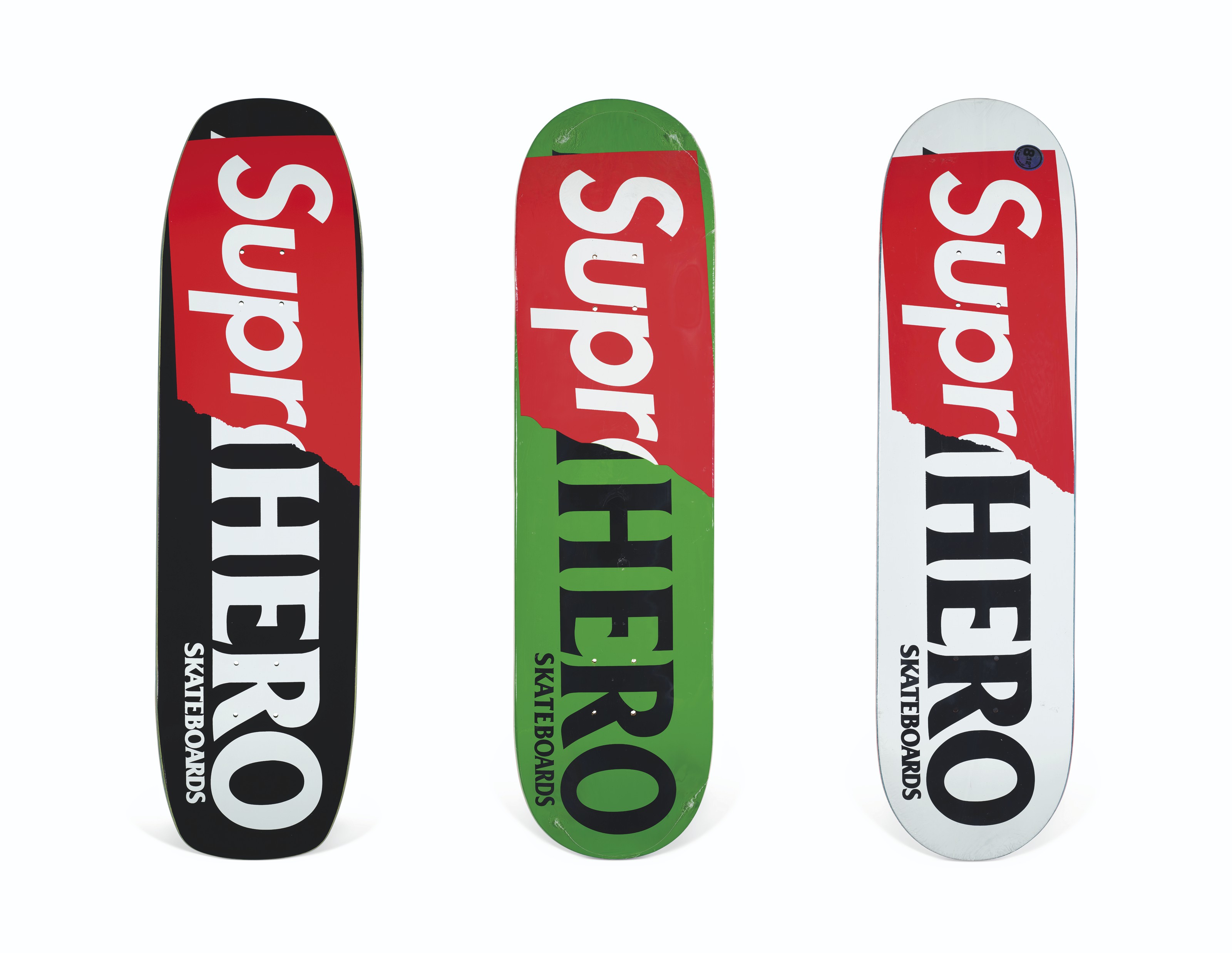 A SET OF THREE SUPREME X ANTIHERO SUPR-HERO SKATEBOARDS, SUPREME 