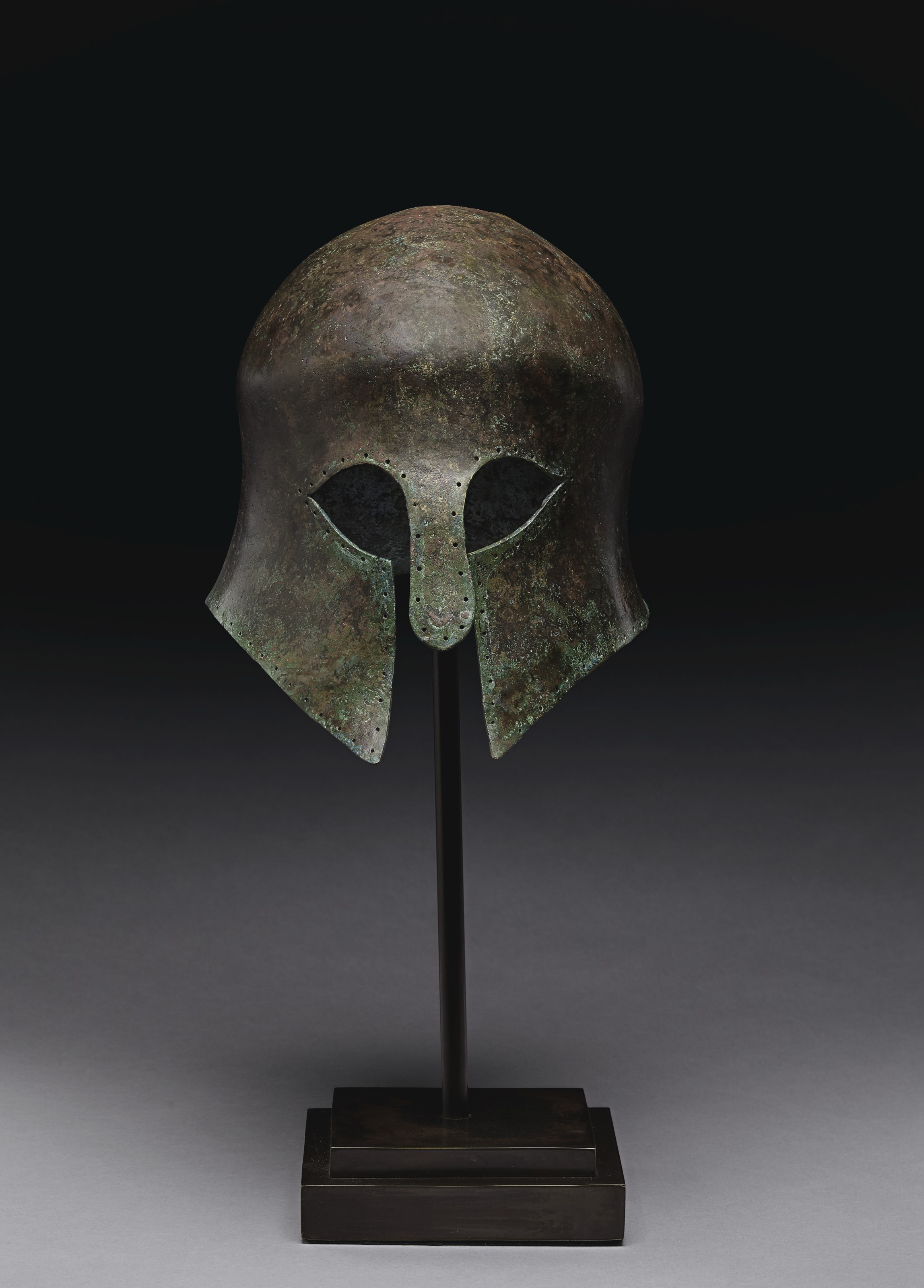 A GREEK BRONZE HELMET OF CORINTHIAN TYPE , ARCHAIC PERIOD, CIRCA MID
