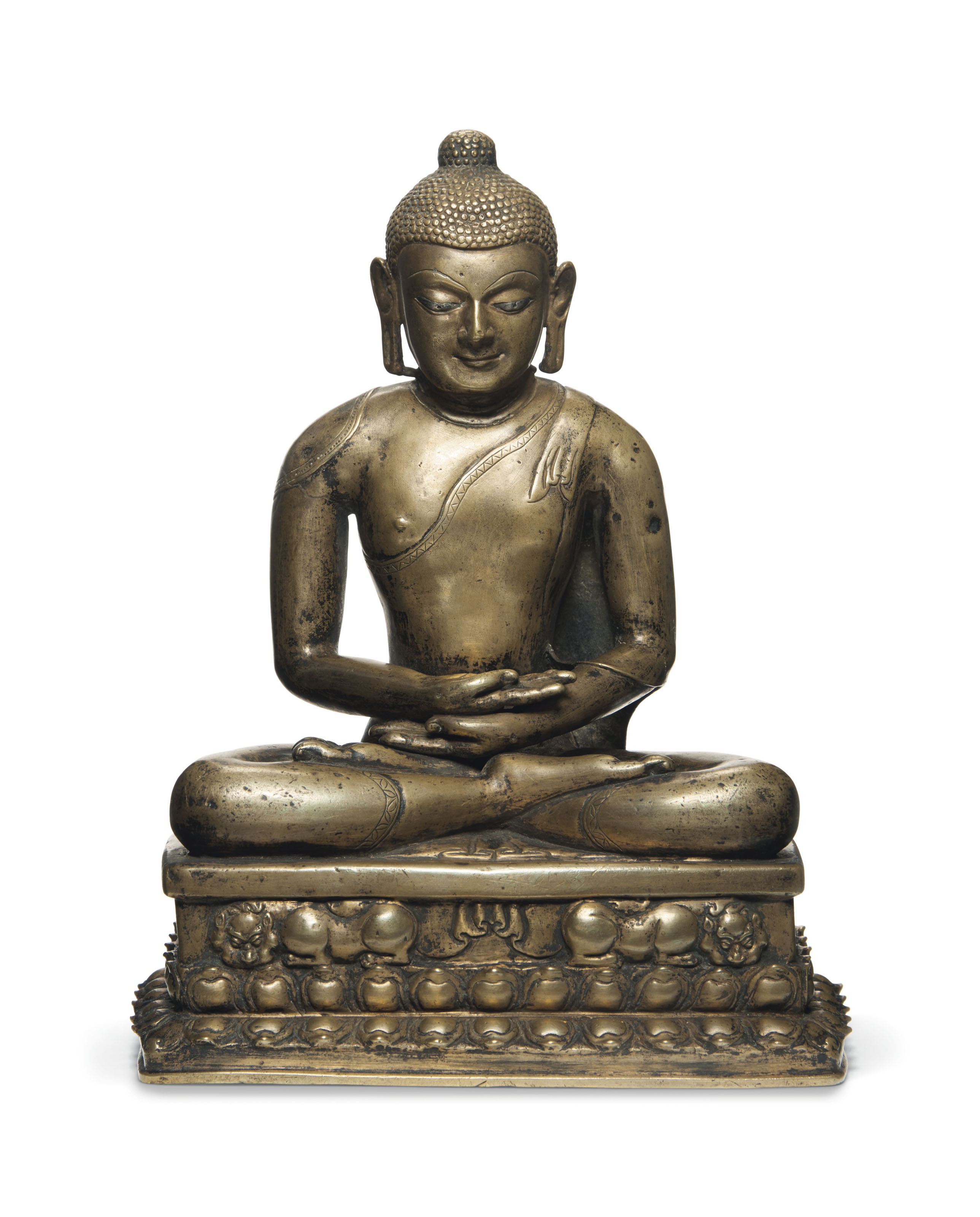 A silver and copper-inlaid bronze figure of a Buddha, Western Tibet, 11th-12th century. 12&frac14;  in (31  cm) high. Sold for $495,000&nbsp;on 21 March 2019 at Christie&rsquo;s in New York