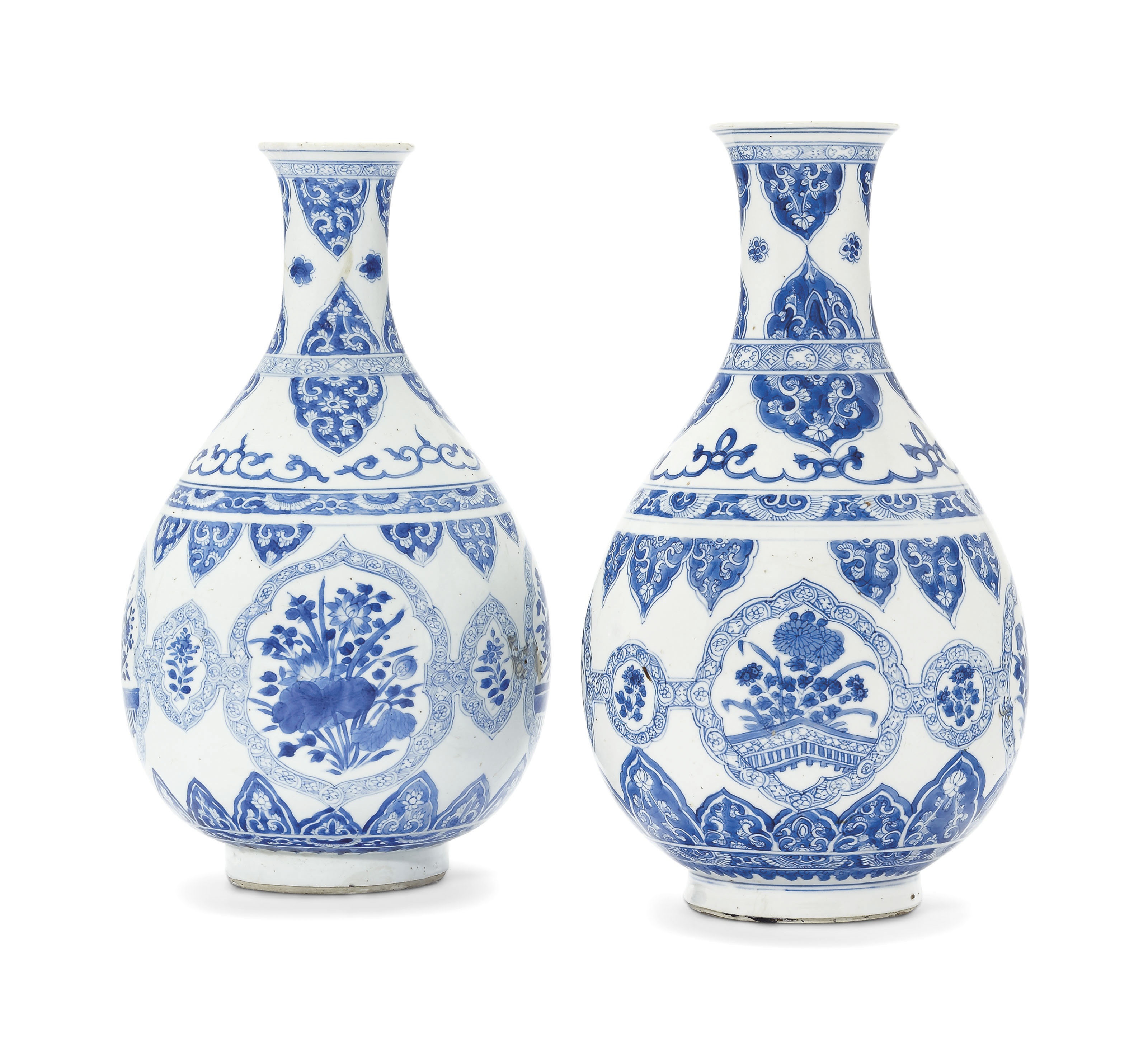 A PAIR OF BLUE AND WHITE BOTTLE VASES