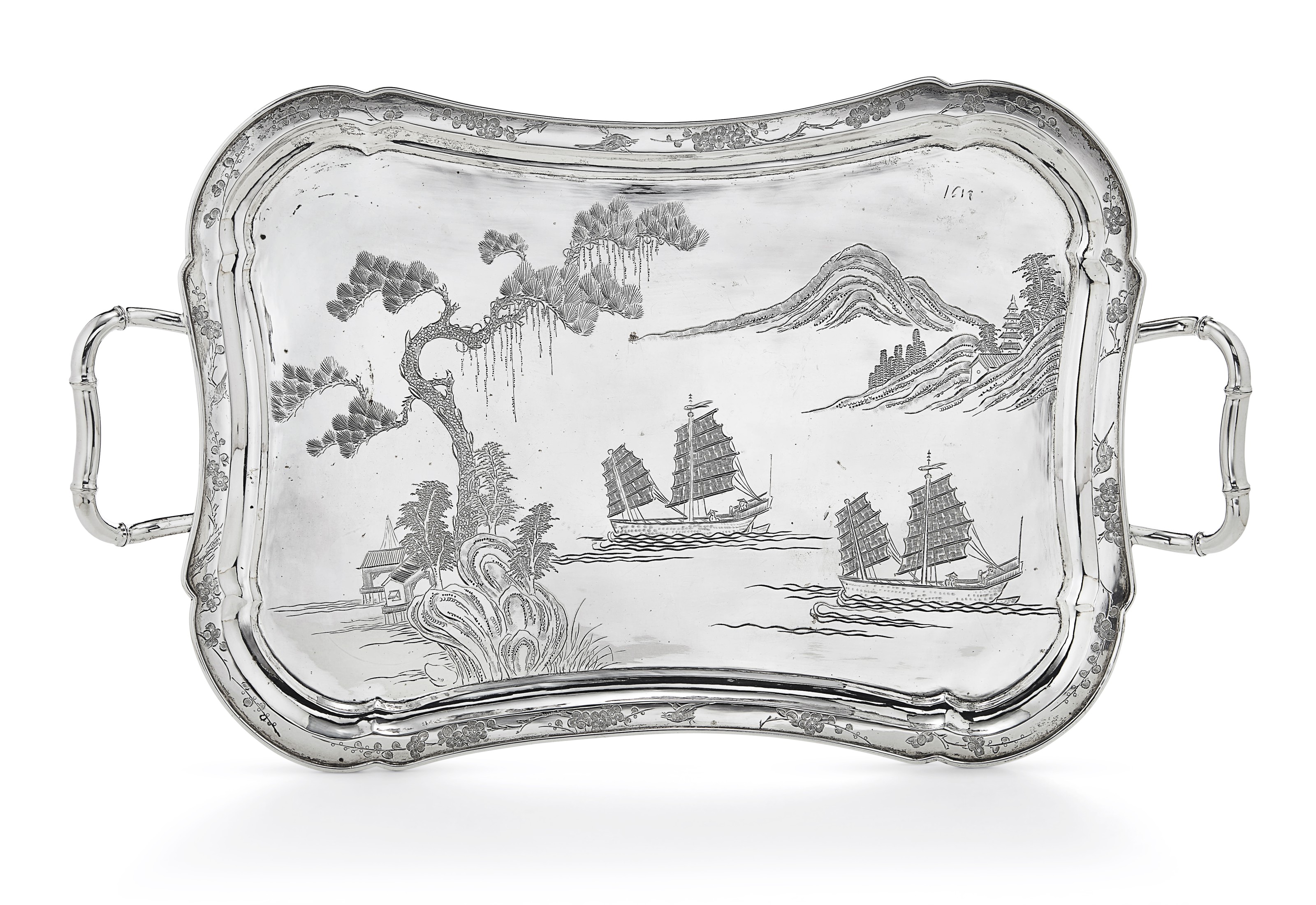 A Chinese export silver two-handled tray, mark of retailer Kwan Hing, Hong Kong, late 19th/early 20th century. 19⅜&nbsp;in (49.2 cm) long, over handles. Estimate: $2,500-3,500. Offered in&nbsp;Chinese and Japanese Export Silver Online: Property from the Collection of Myrna and Bernard Posner, Online 15-22 August 2019