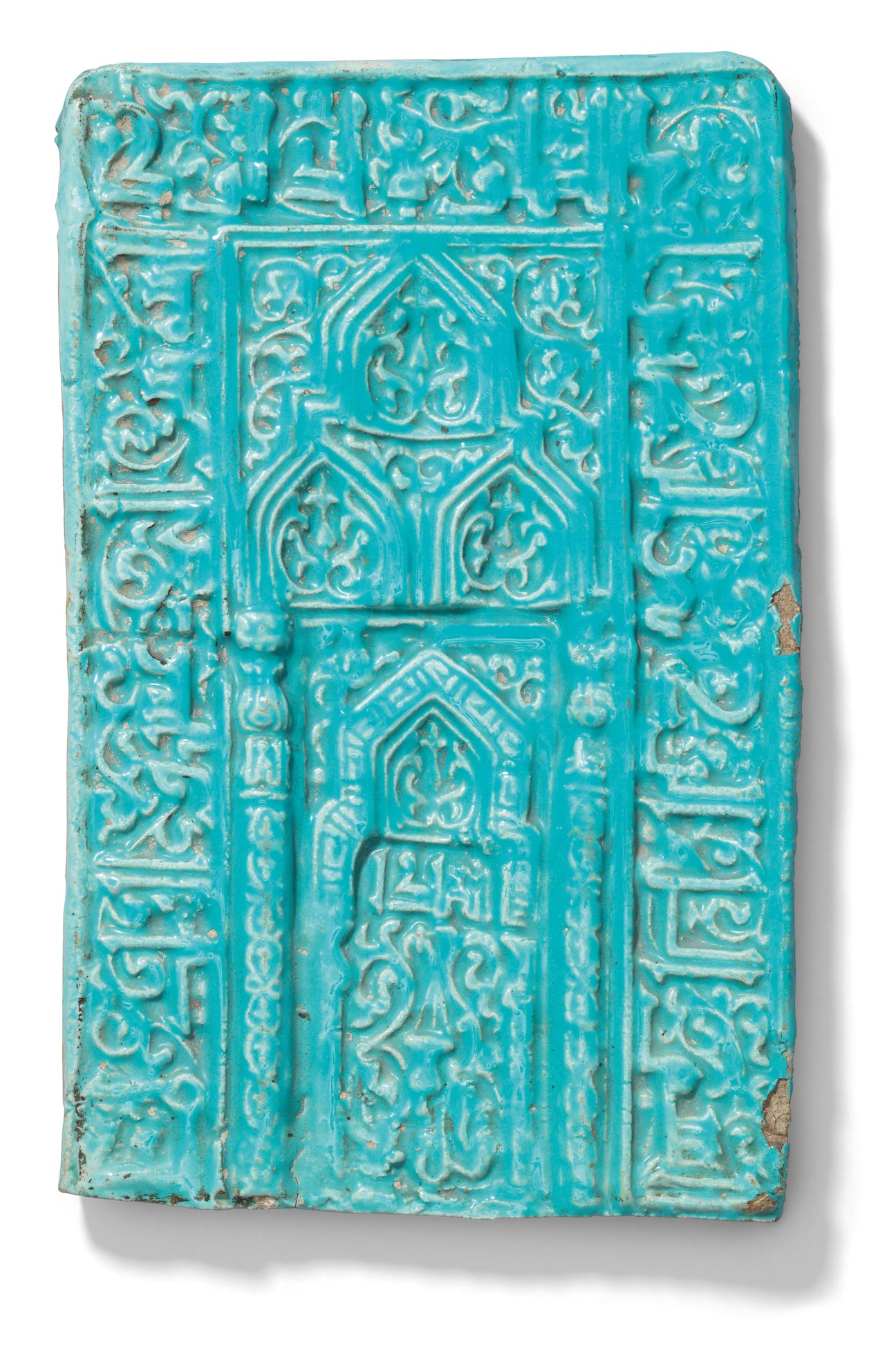 A KASHAN MOULDED TURQUOISE MIHRAB TILE, CENTRAL IRAN, CIRCA 1200 ...
