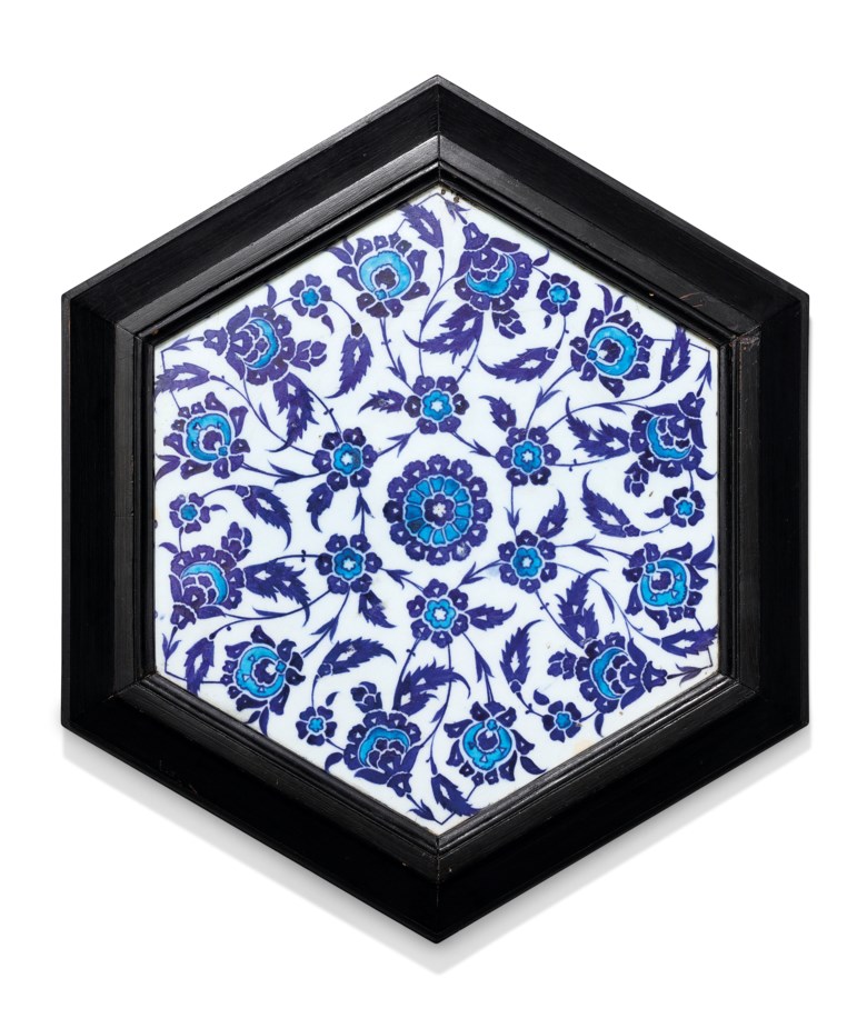A blue and white hexagonal Iznik tile, Ottoman Turkey, circa 1530. 10½ in (26.5 cm) diam. Estimate £6,000-8,000. Offered in Art of the Islamic and Indian Worlds Including Oriental Rugs and Carpets on 25 June 2020 at Christie’s in London
