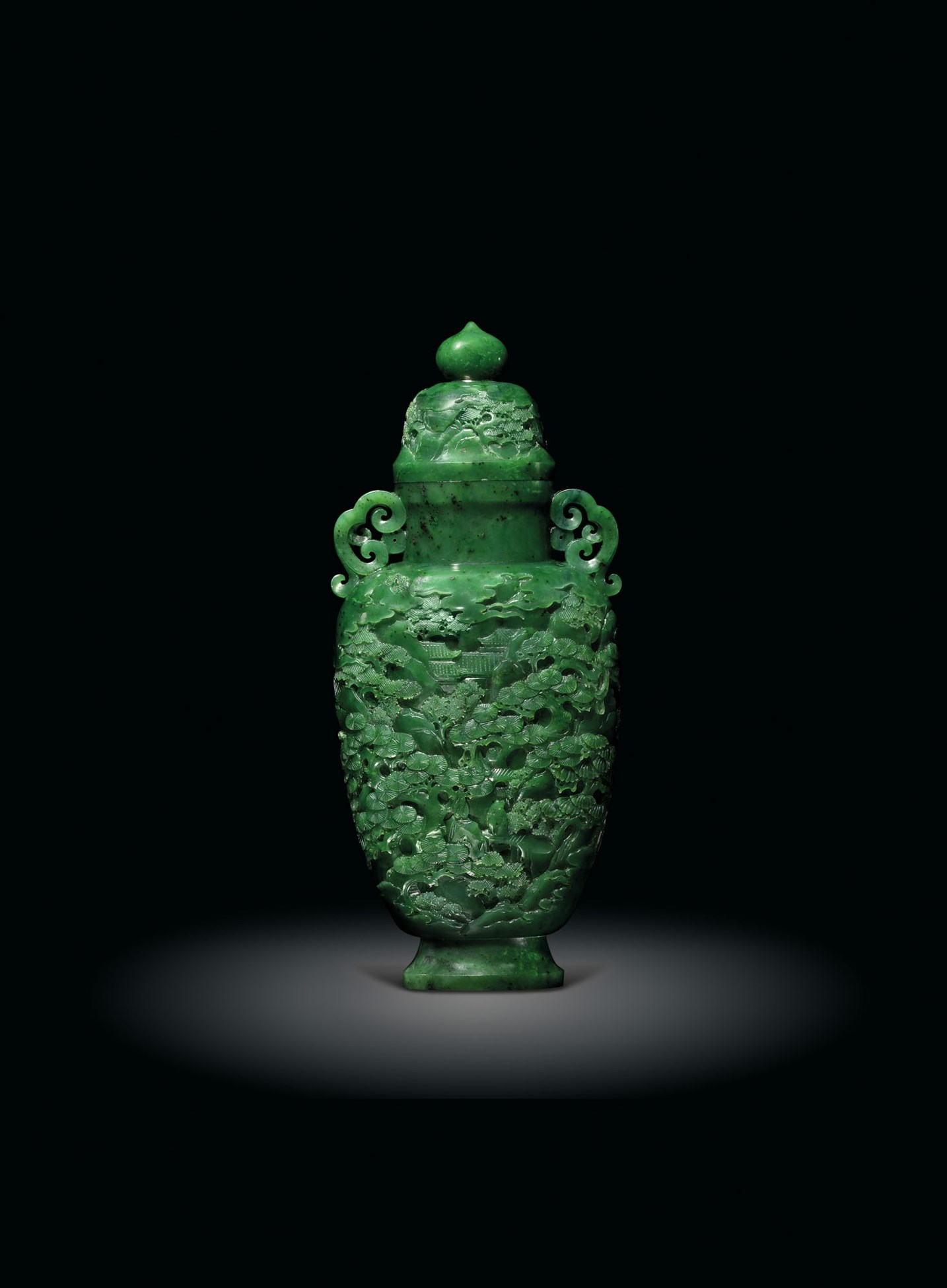 A FINELY CARVED SPINACHGREEN JADE 'LANDSCAPE' VASE AND COVER, 18TH