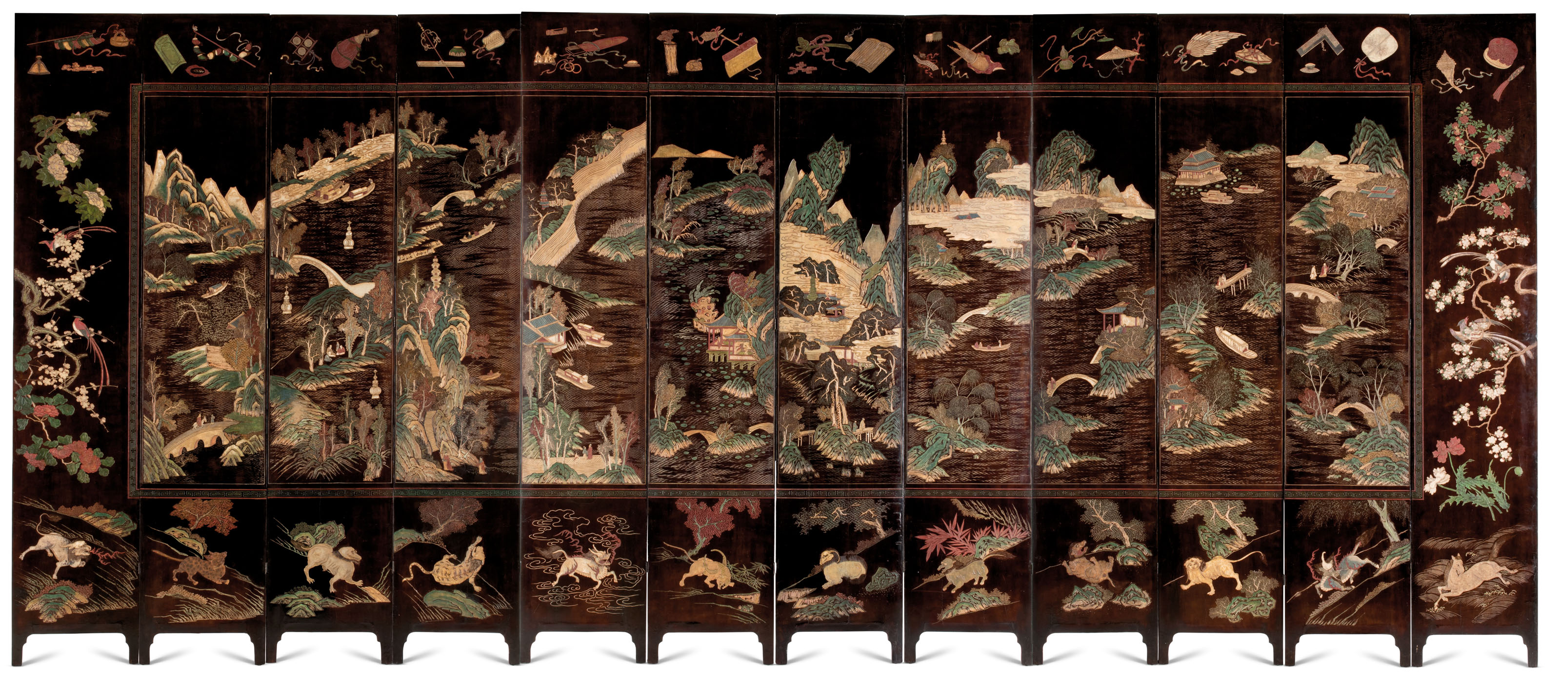 A MAGNIFICENT TWELVEFOLD COROMANDEL LACQUER SCREEN , KANGXI PERIOD