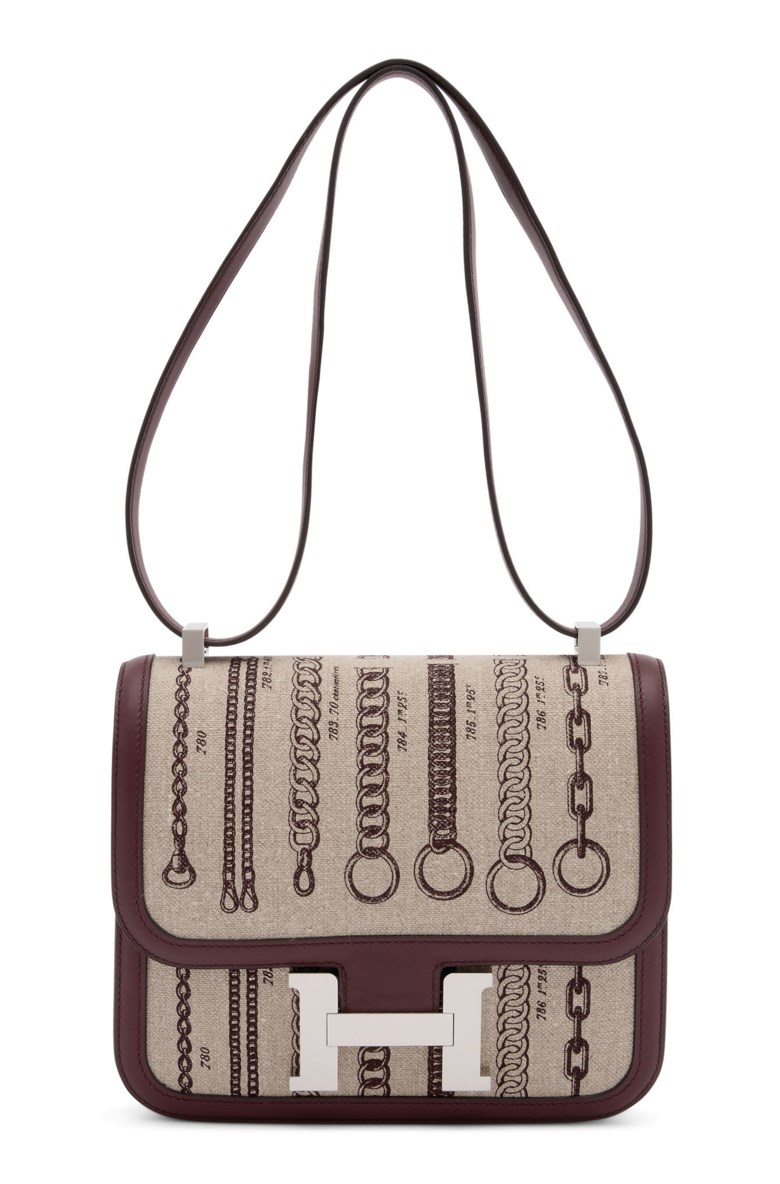 A limited edition bordeaux swift leather & toile de camp déchaînée Constance 24 with palladium hardware, Hermès, 2018. 24 w x 19 h x 7 d cm . Estimate £8,000-10,000. Offered in Handbags Online The London Edition, 9-25 June 2020, Online
