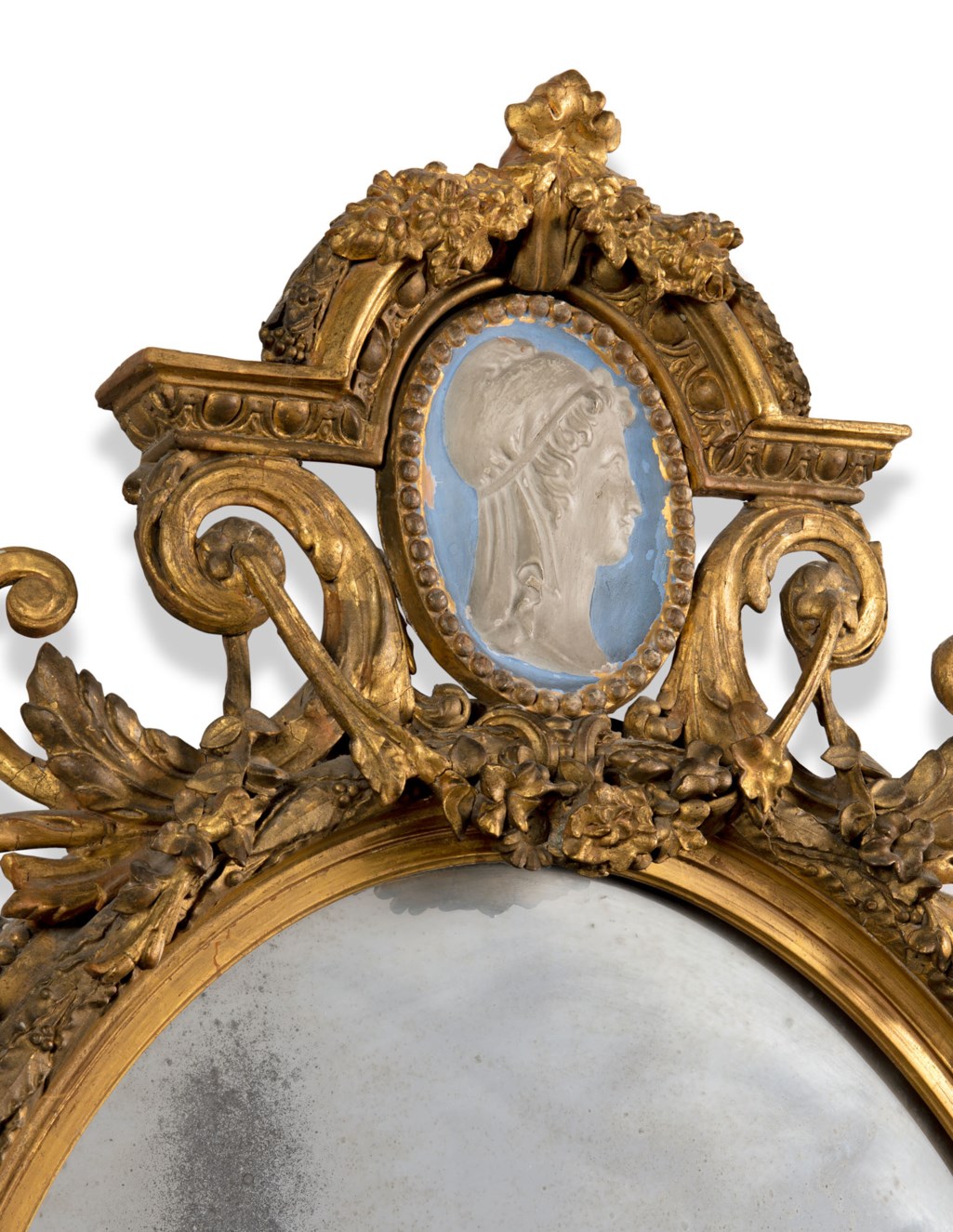 A VICTORIAN GILTWOOD AND OVAL MIRROR, SECOND HALF 19TH CENTURY Christie’s