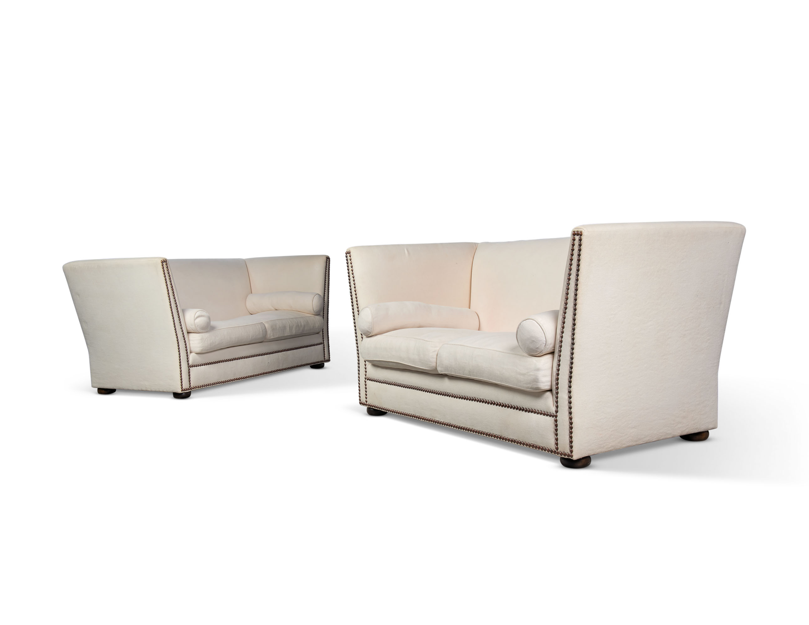 A PAIR OF ENGLISH BRASSSTUDDED WHITE SOFAS, BY KATHARINE POOLEY