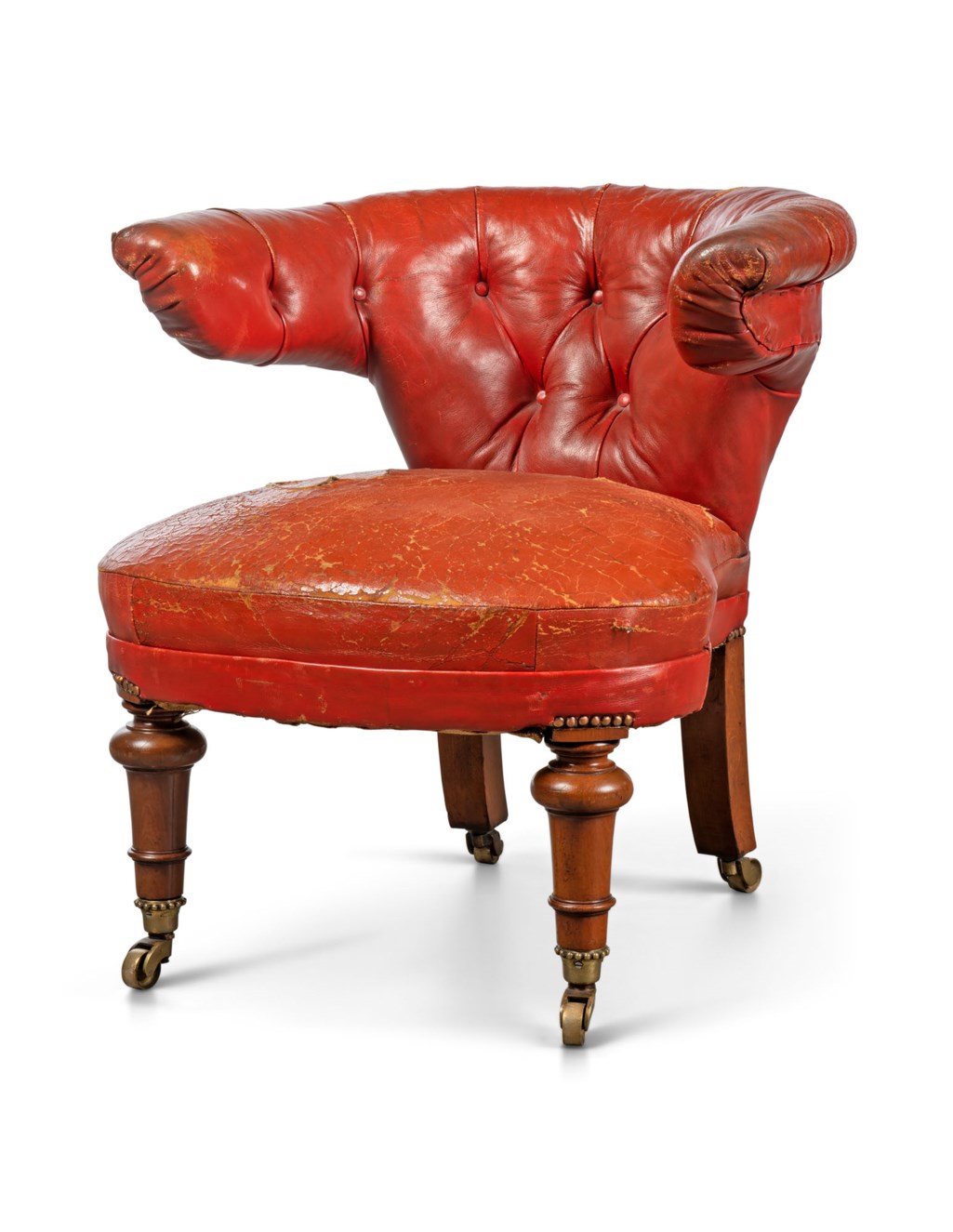 AN EARLY VICTORIAN WALNUT AND REDLEATHER READINGCHAIR, MID19TH CENTURY Christie’s