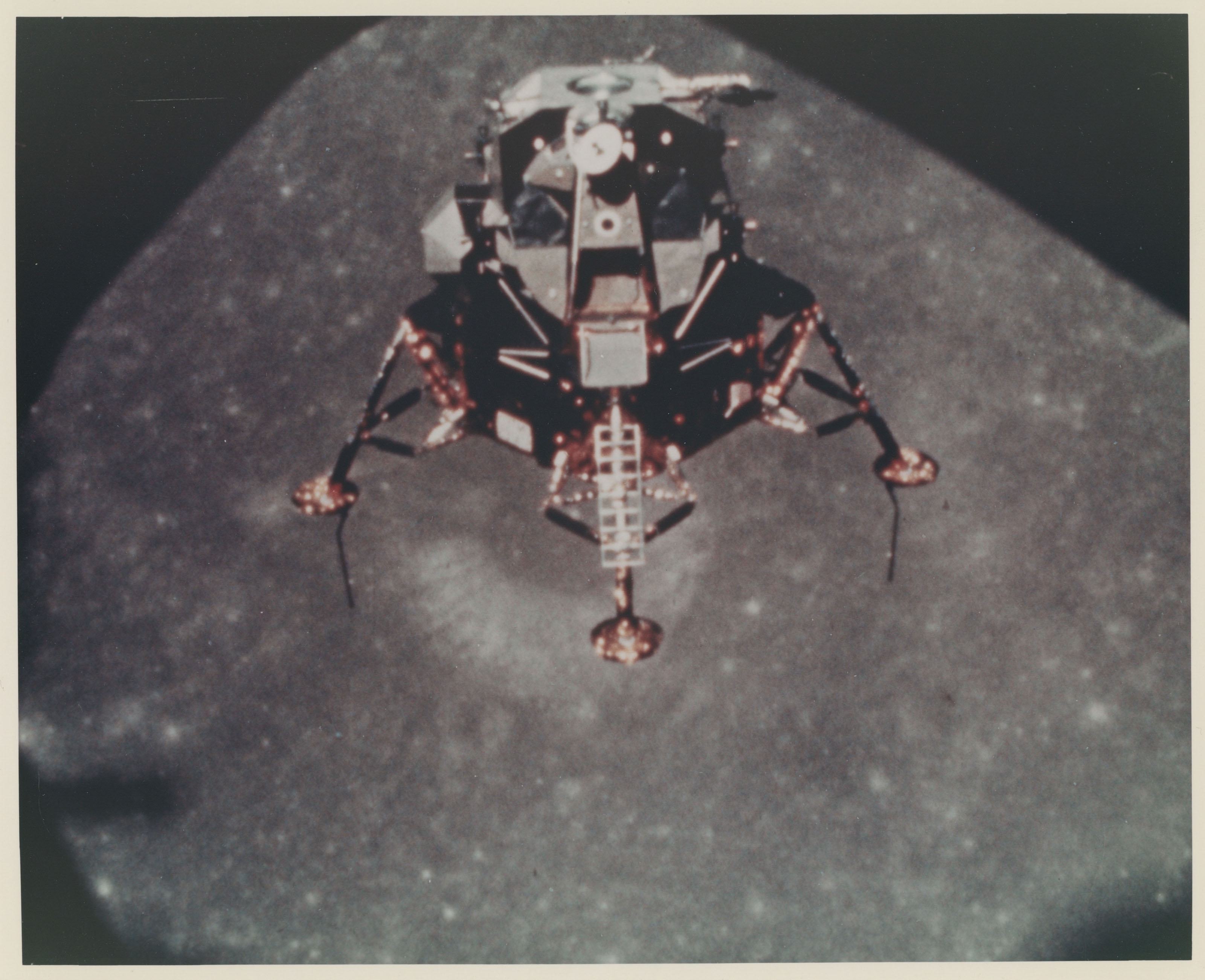 The LM Intrepid in lunar orbit; lunar horizon over Crater Copernicus at ...