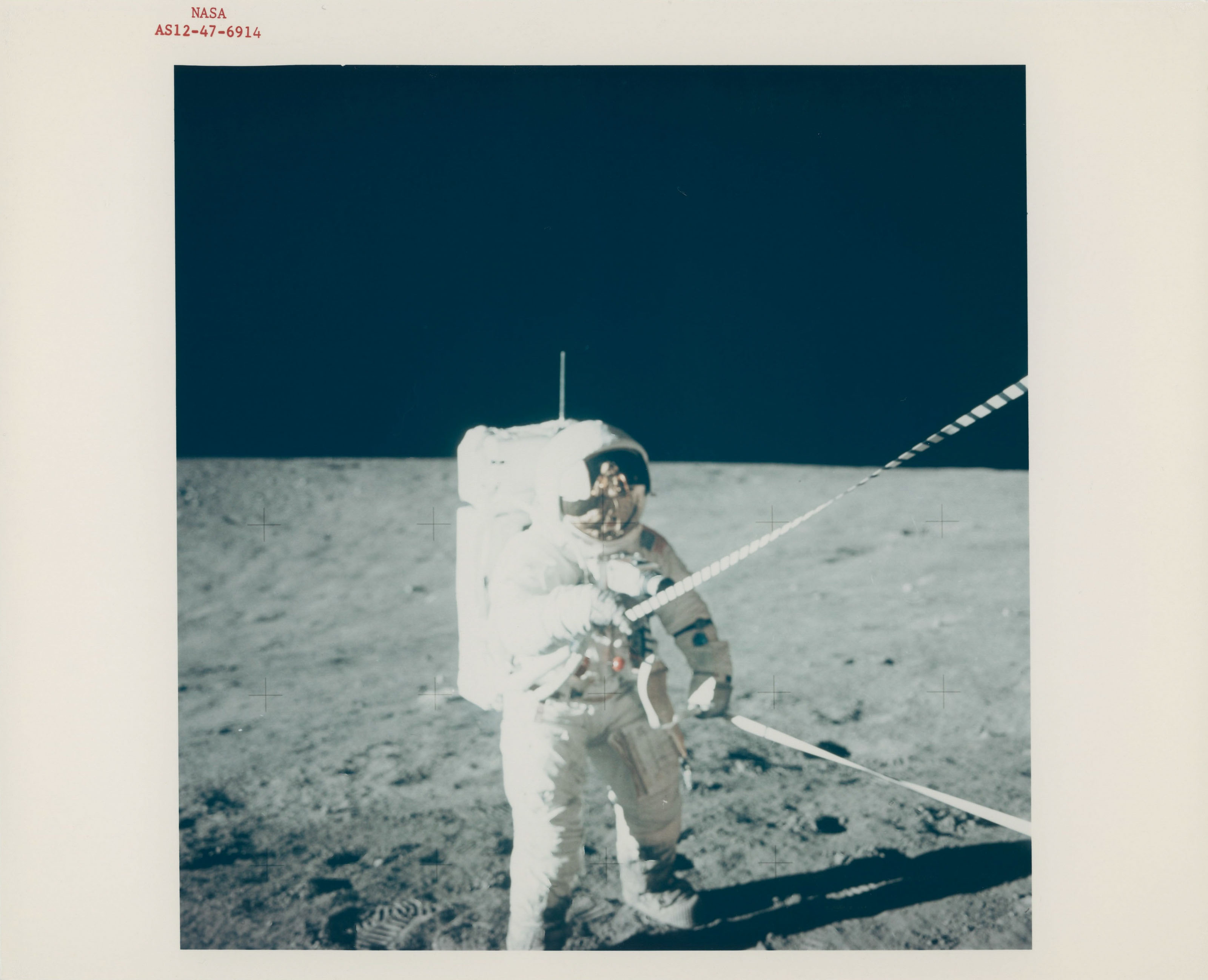 Pete Conrad with the reflection of the LM in his visor; triptych of ...