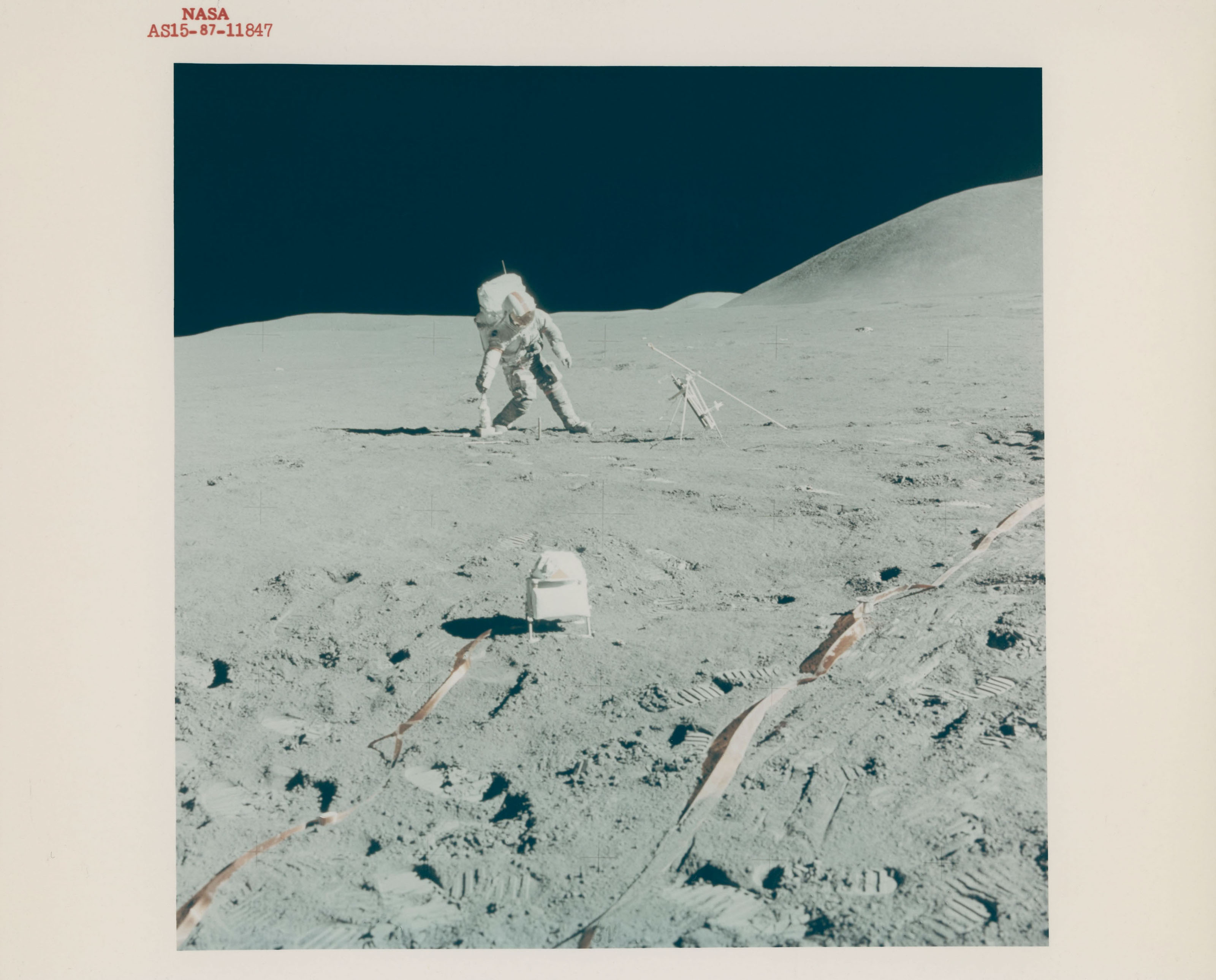 Views at the lunar-science station: David Scott leaning; panoramic view ...
