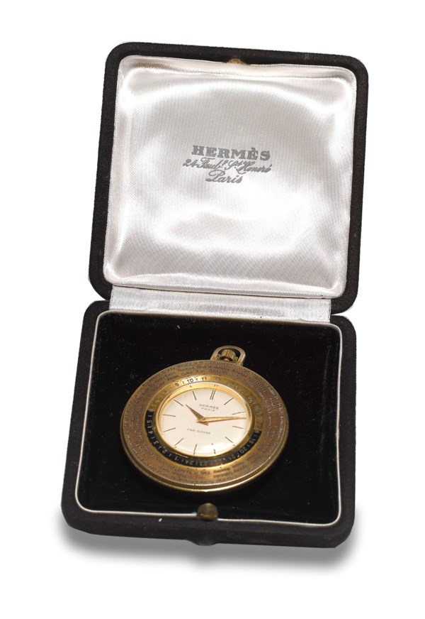 HERMES, GILT BRASS WORLD TIME POCKET WATCH, CASE NO. 24991 Christie’s