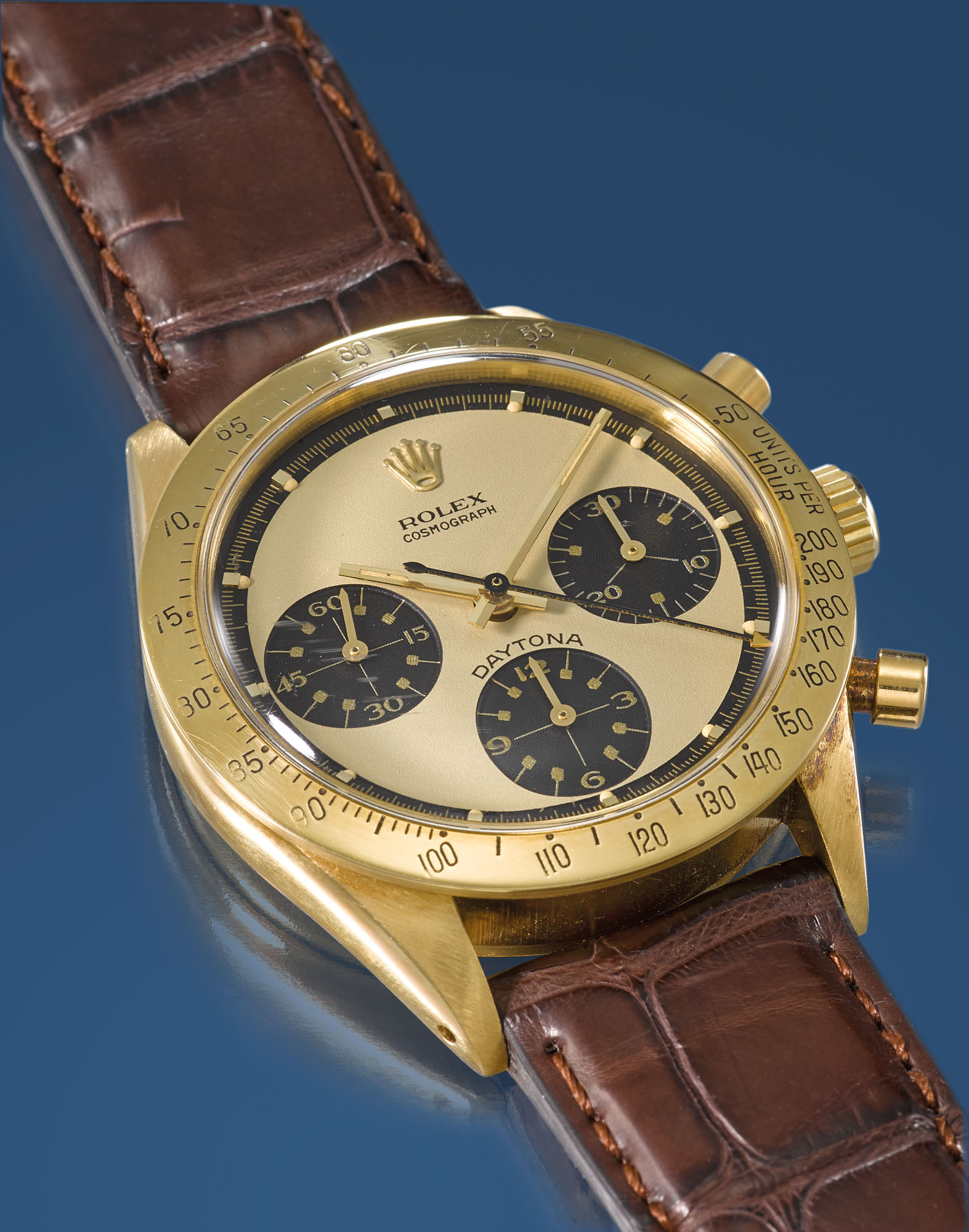 Rolex. A very fine and extremely rare 18K gold chronograph wristwatch with champagne Paul Newman dial certificate and box Signed Rolex Cosmograph Daytona Paul Newman model ref. 6239 case no. 2 056 763...