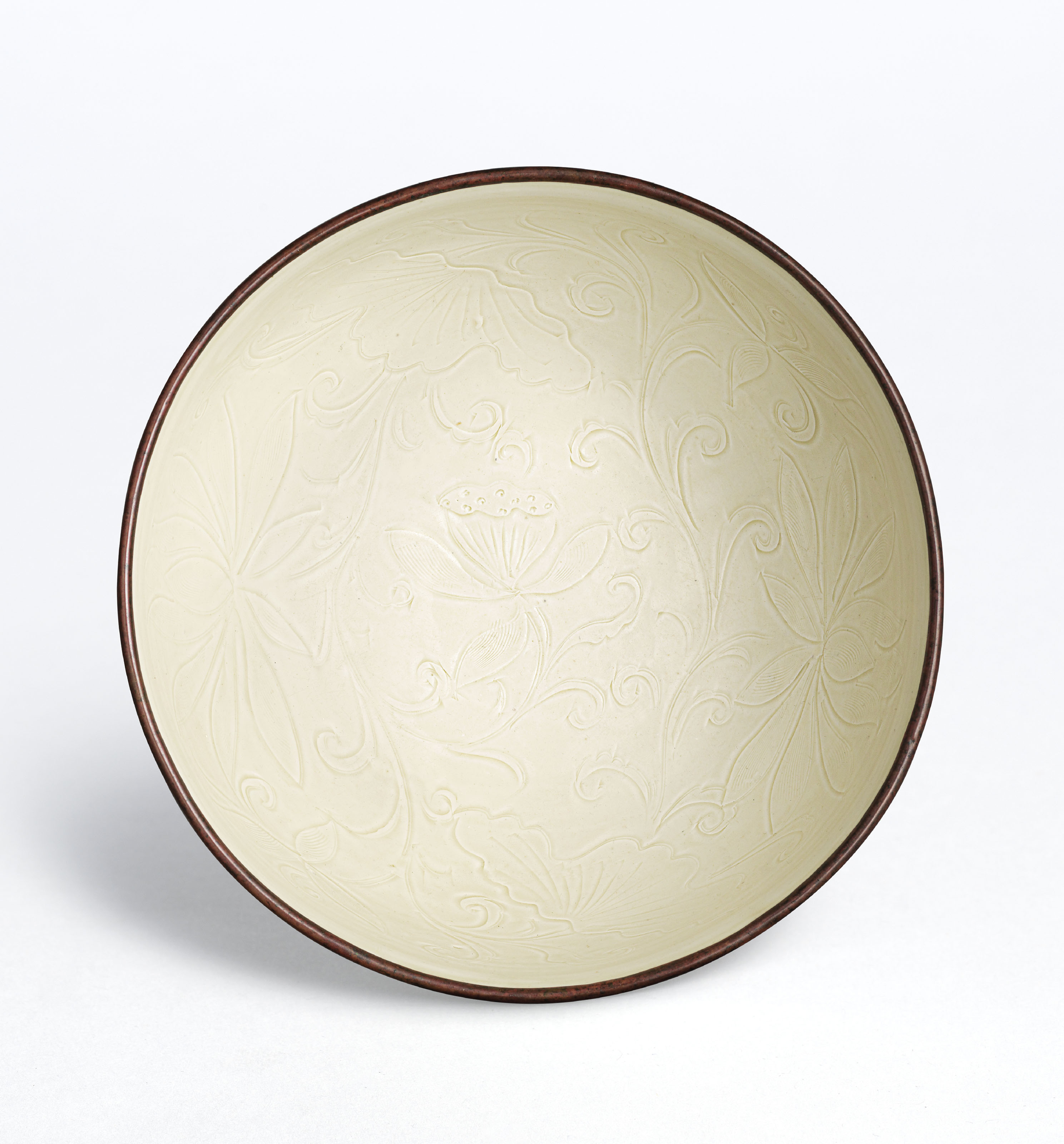 AN EXTREMELY RARE AND FINE LARGE DING ‘LOTUS’ BOWL