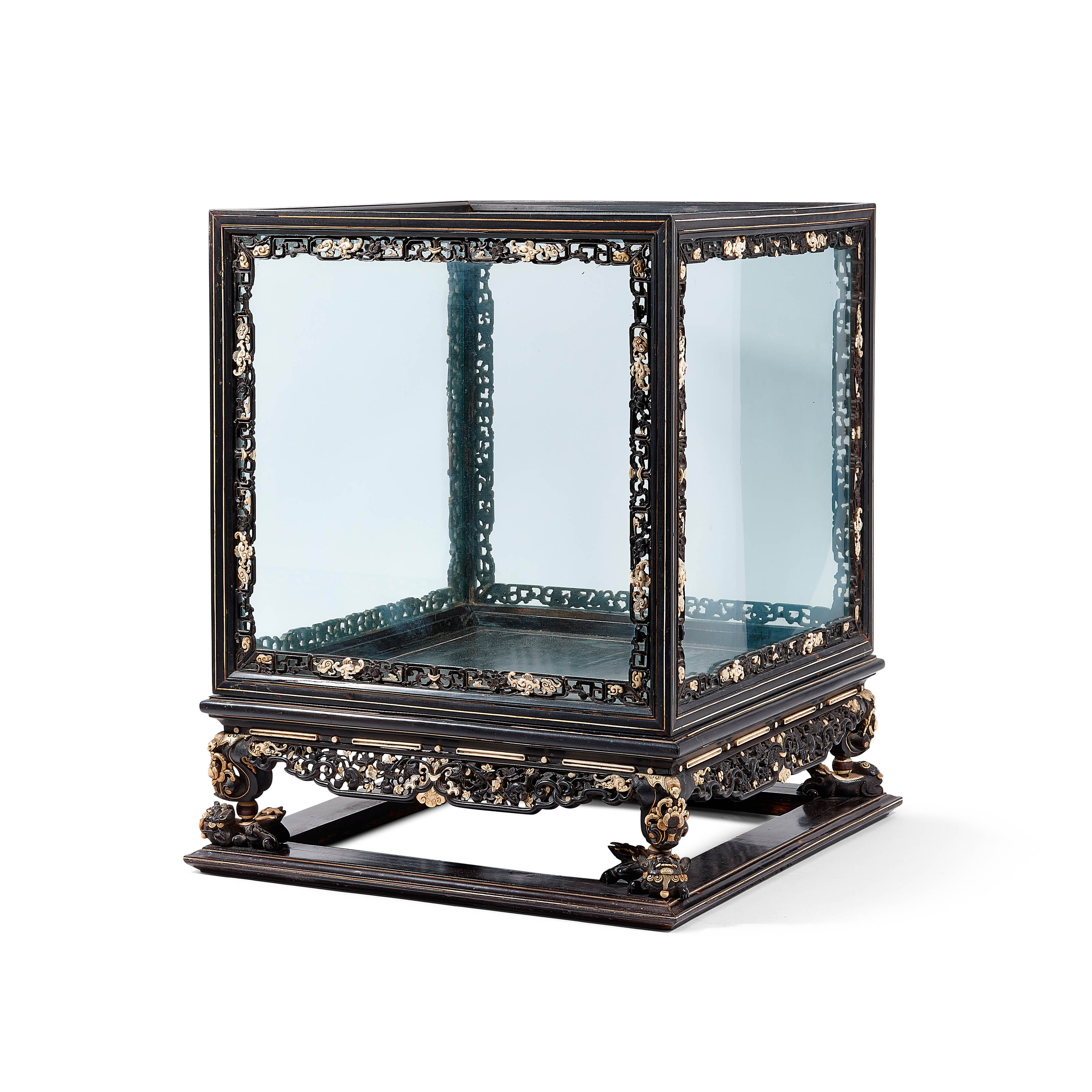 A CARVED AND INLAID HARDWOOD DISPLAY AND STAND, Christie’s