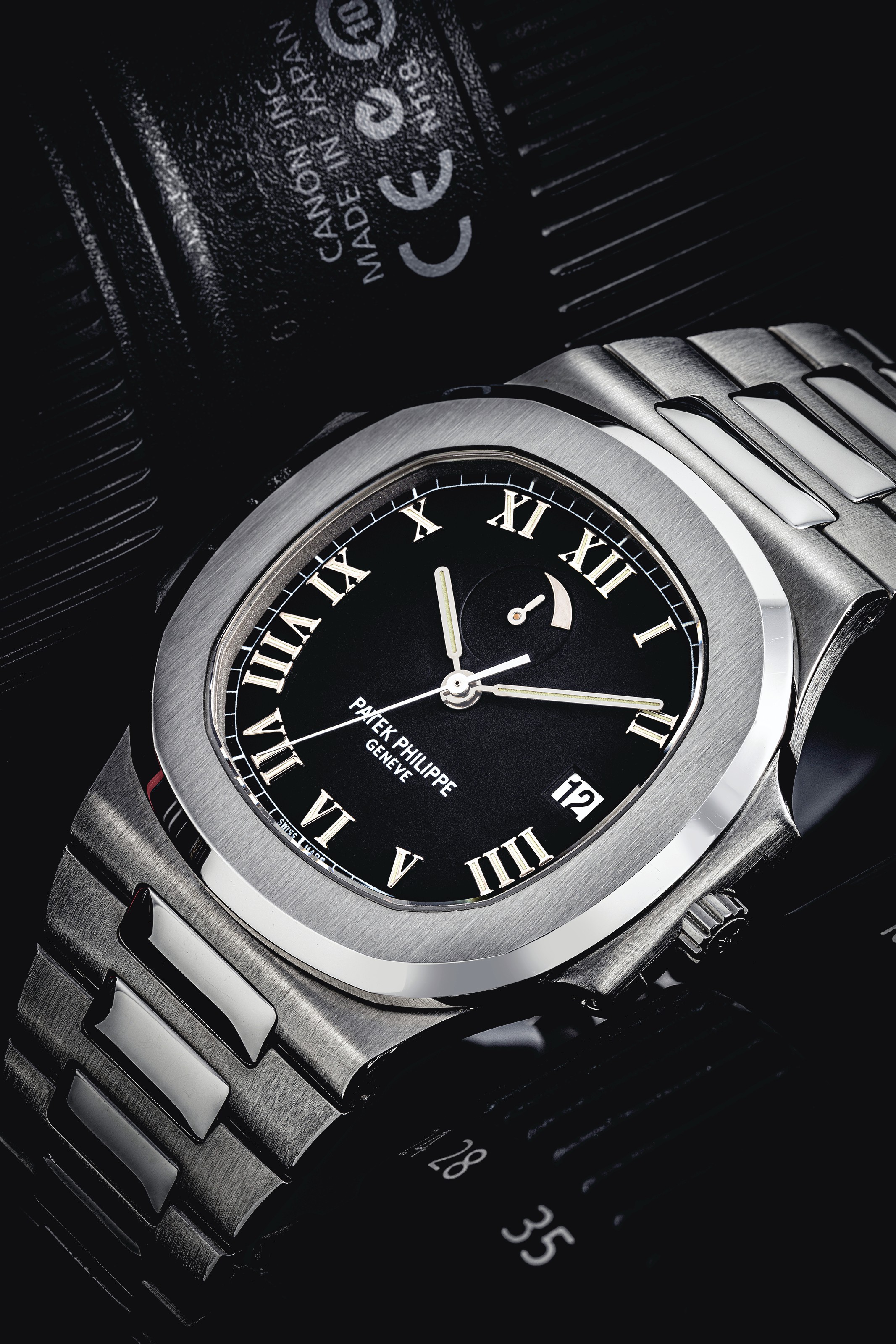 Patek Philippe A Stainless Steel Automatic Wristwatch With Sweep Centre Seconds Date Power Reserve And Bracelet Signed Patek Philippe Geneve Nautilus Model Ref 3710 Movement No 3 148 160 Case No 4 050 538 Manufactured