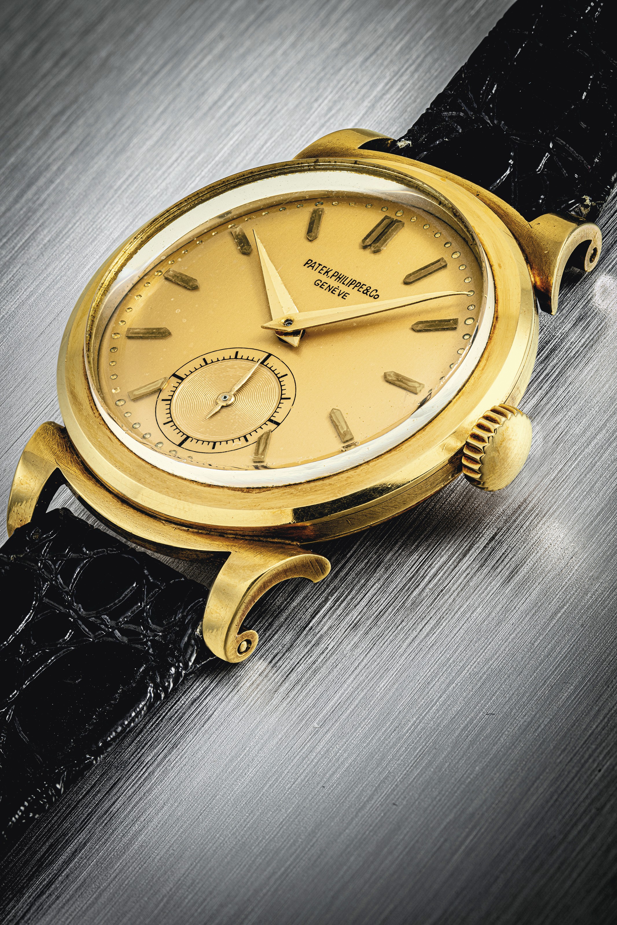 PATEK PHILIPPE. AN EXTREMELY RARE PLATINUM CUSHION SHAPED